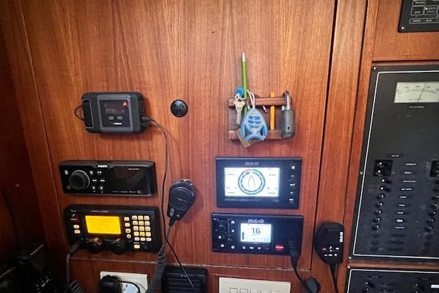Control panel of a 1985 Robert Clark Ketch with navigation and communication equipment.