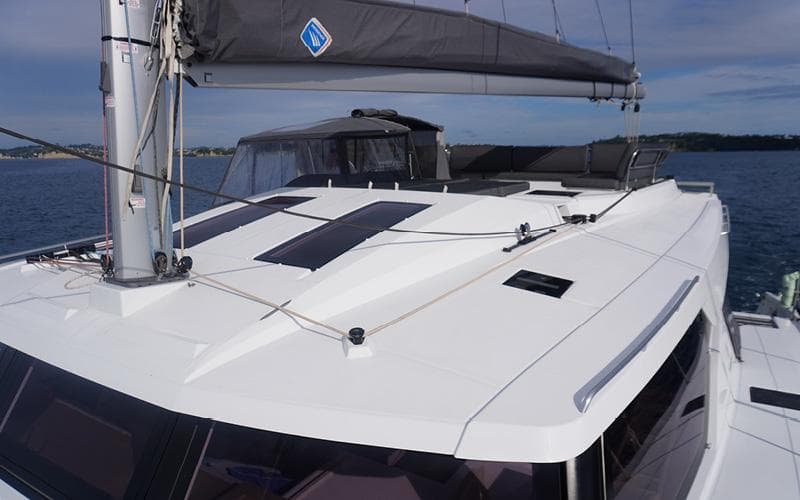 2022 Fountaine Pajot Elba 45 catamaran, sleek deck design, sailing on calm waters.