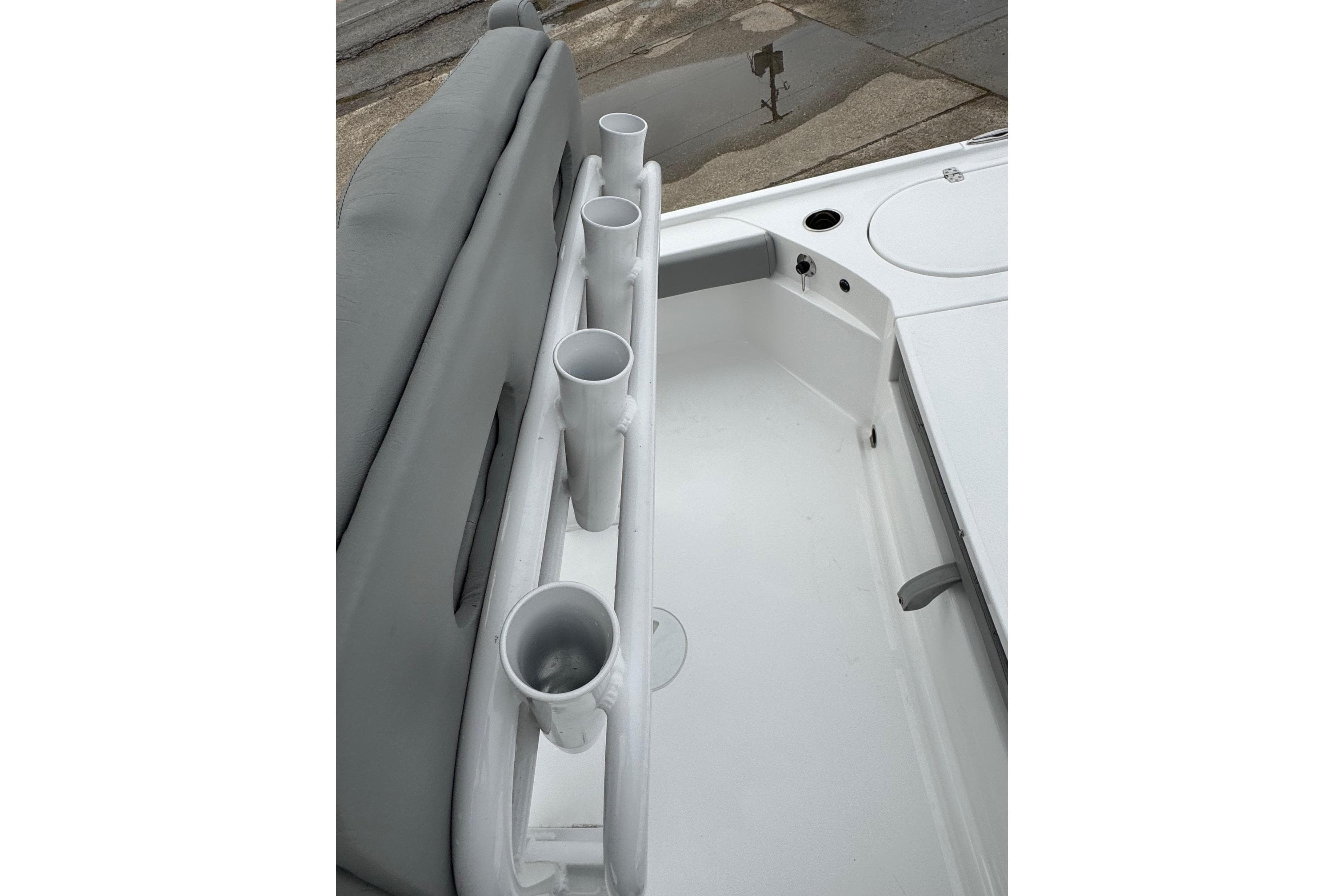 2026 Blazer Bay 2440 boat interior with rod holders and seating.
