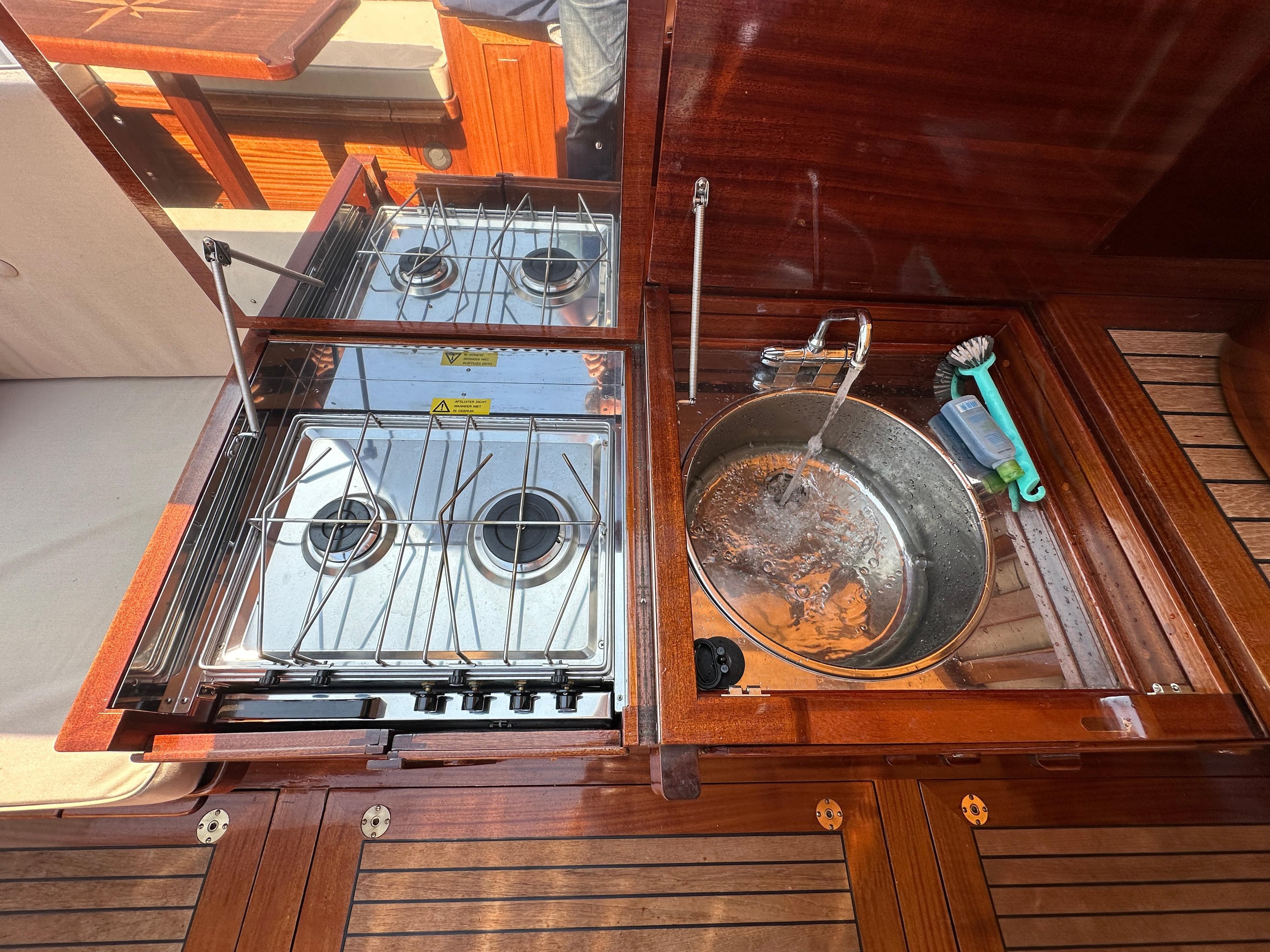 Compact kitchen area on 2005 Breedendam MTB 31 with stove and sink.