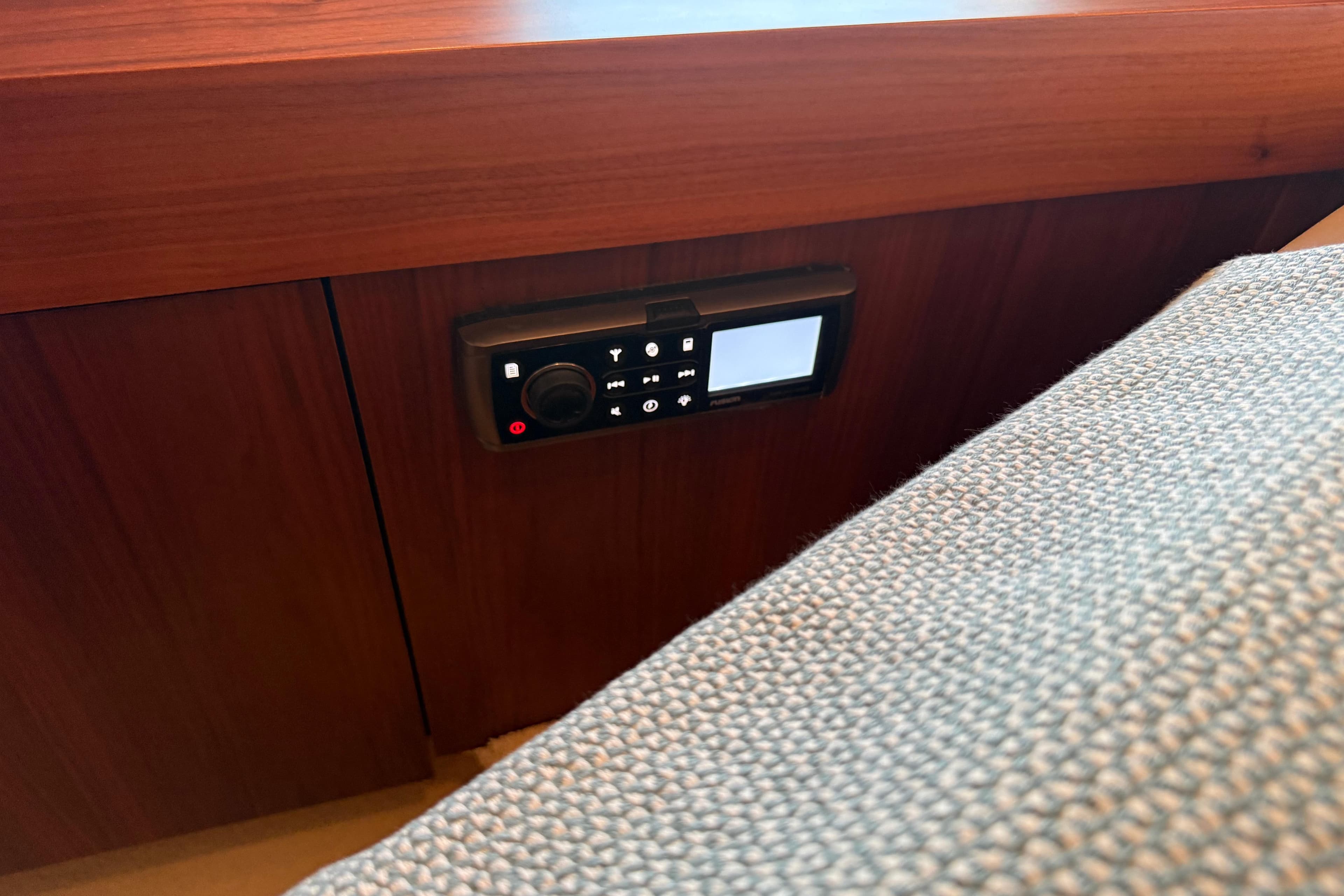 Control panel on 2012 Sunseeker Predator 60 yacht, mounted on wooden interior.