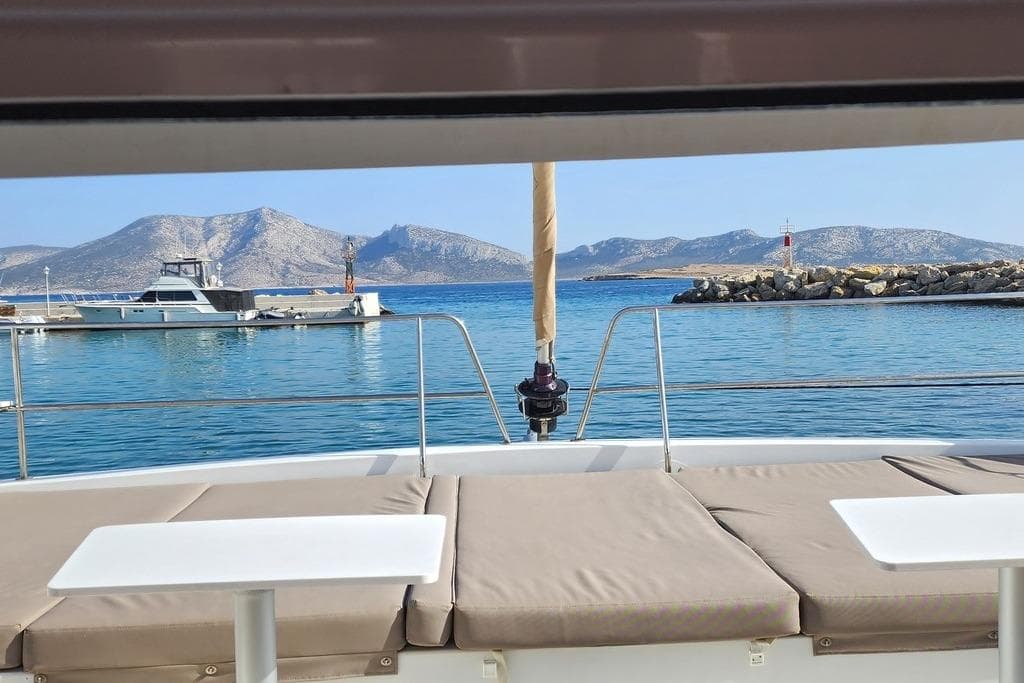 View from Bali 4.5 catamaran, 2016 model, overlooking serene sea and distant mountains.