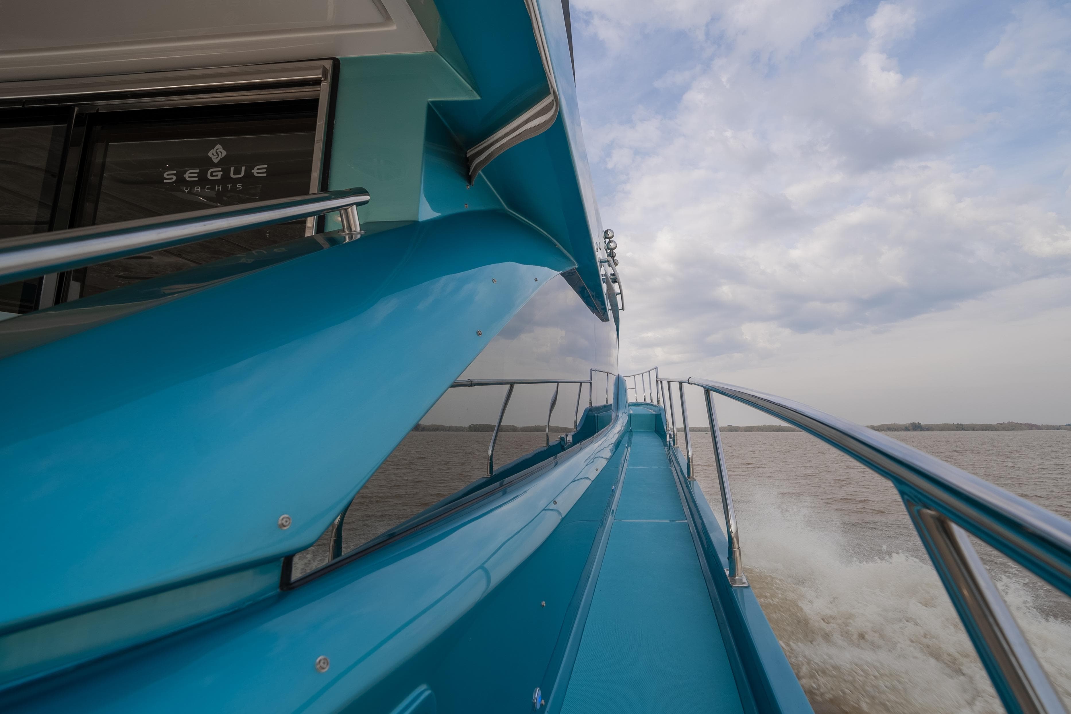2026 Segue X6 Black Edition yacht cruising on open water under cloudy skies.