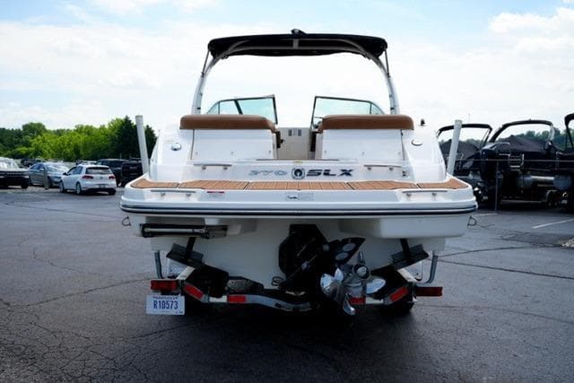 2014 Sea Ray 270 SLX boat on trailer, rear view in parking lot.