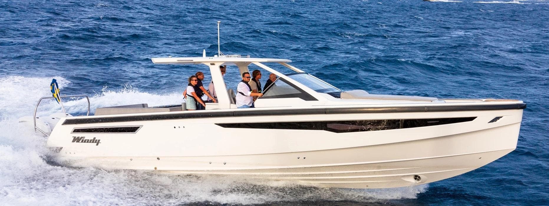 Manufacturer Provided Image: 2023 Windy SR44 SX boat cruising on the ocean with passengers.