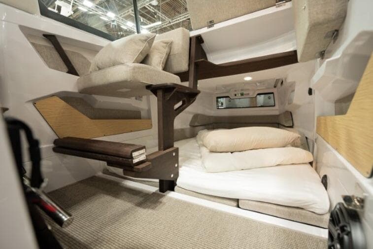 Interior of 2027 Axopar 29 XC Cross Cabin with cozy sleeping area and modern design.