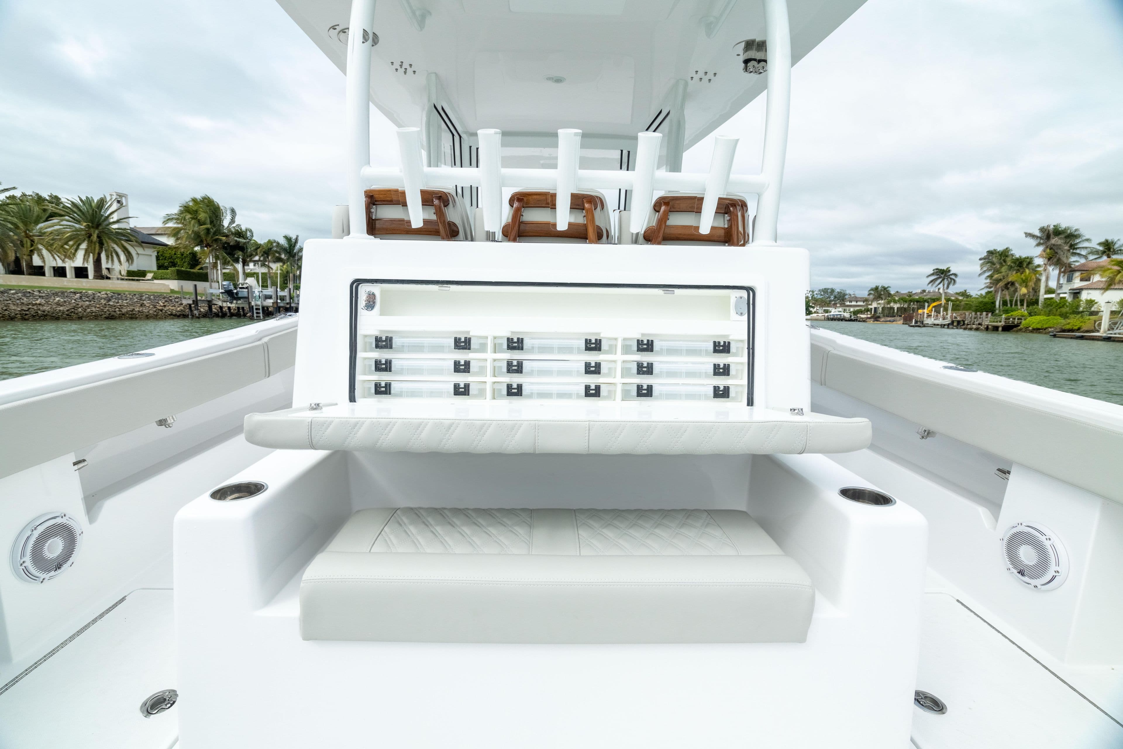 2025 Front Runner 37 Catamaran interior with seating and storage, on a calm waterway.