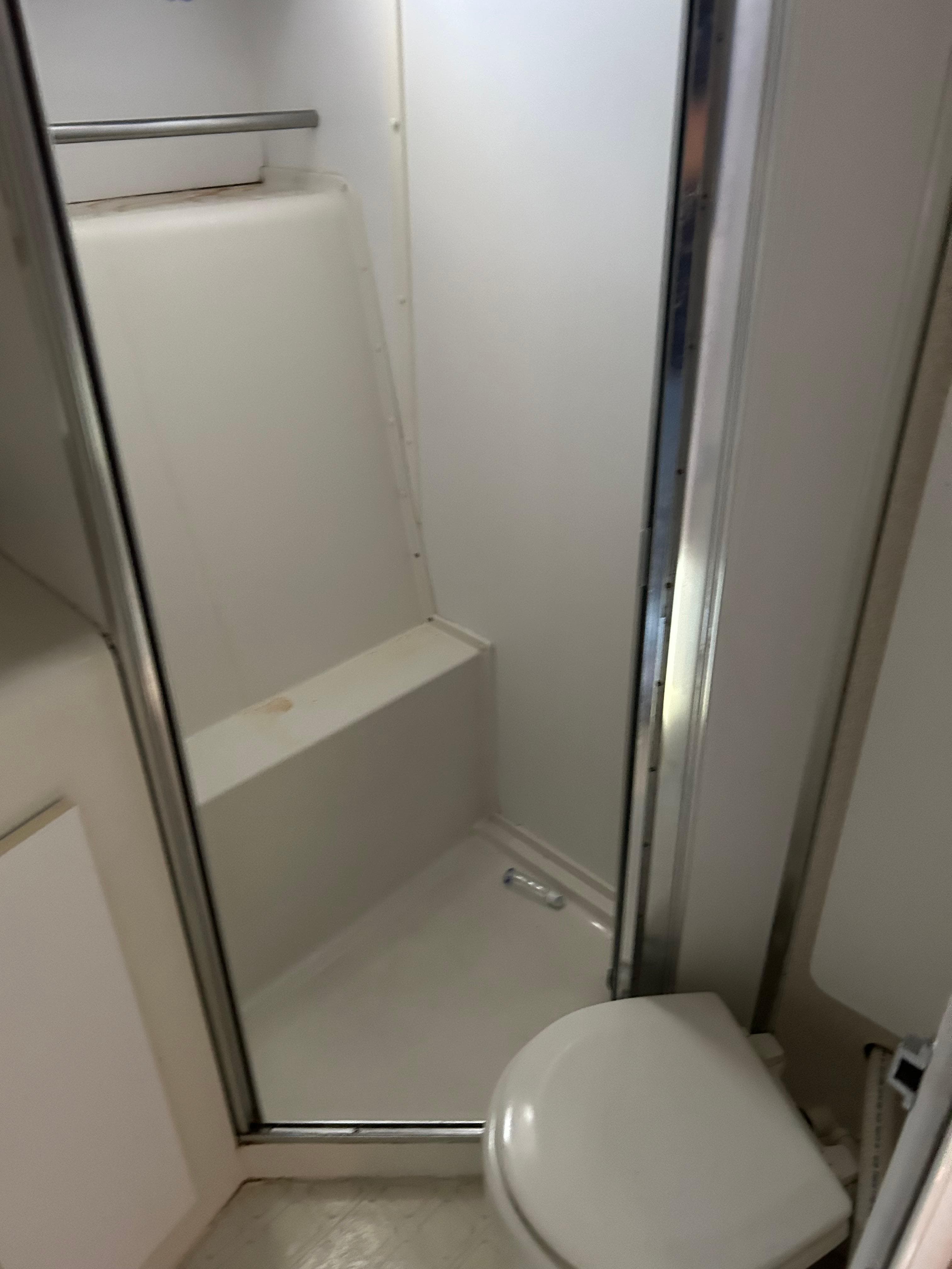 1995 Silverton AFT CABIN bathroom with shower and toilet.