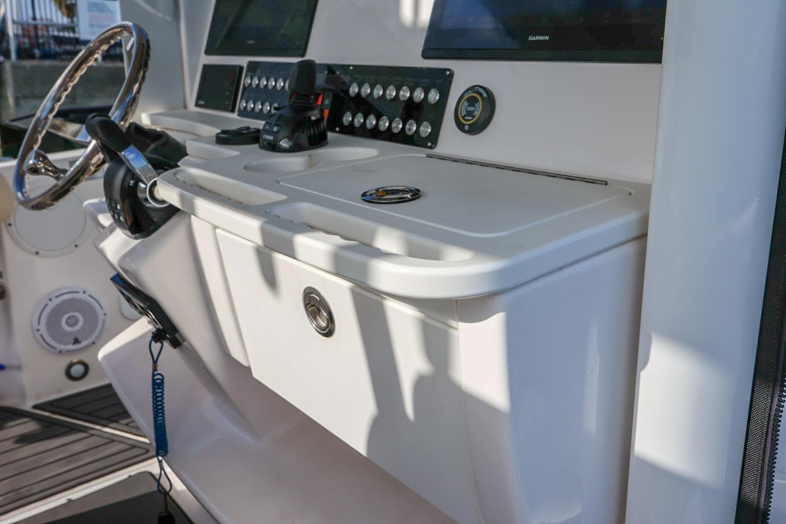 2017 Everglades 355 Center Console boat dashboard with steering wheel and control panel.