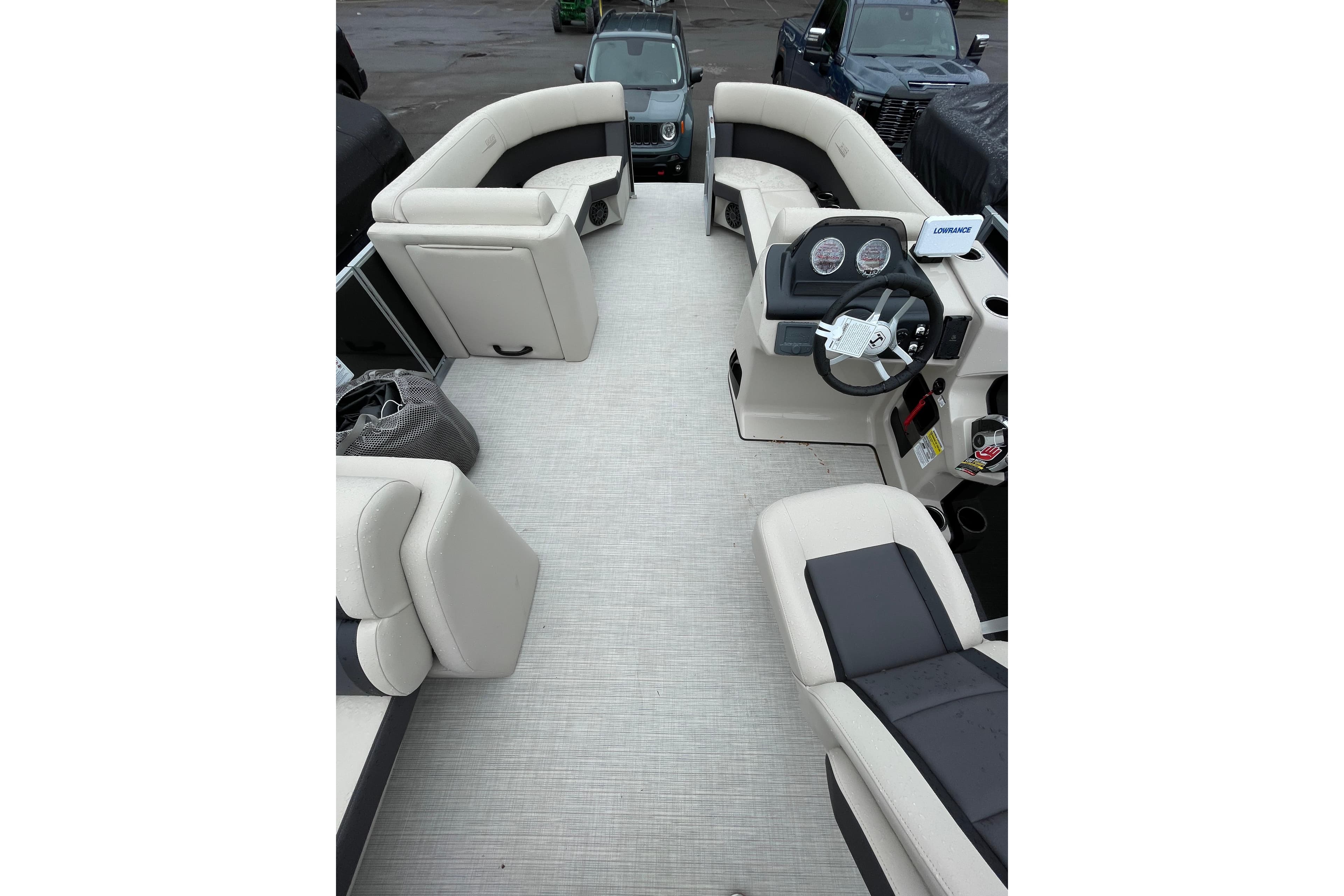 Interior view of 2026 Harris Cruiser 230 SL pontoon boat with plush seating and modern dashboard.