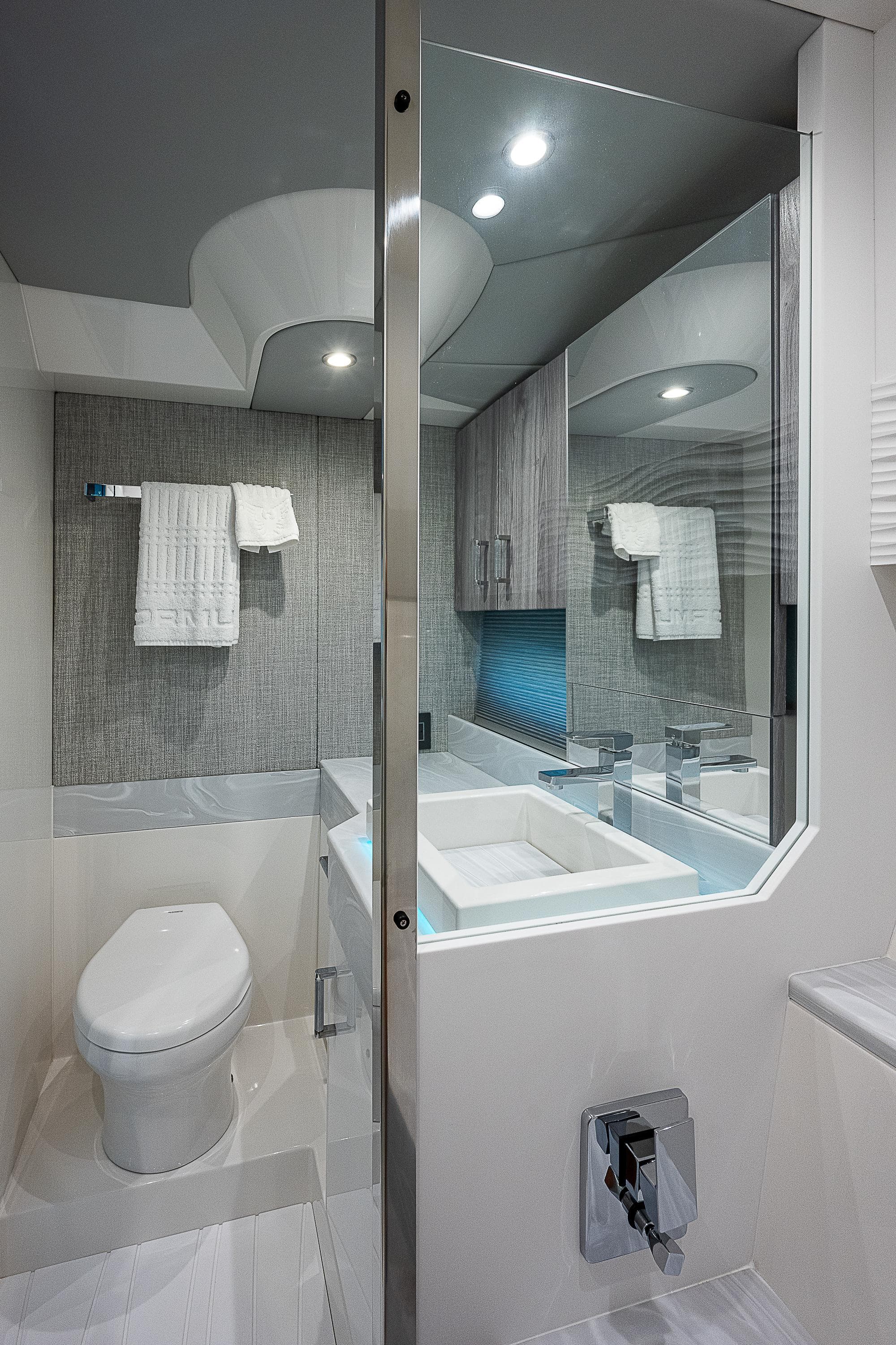 Modern bathroom in 2022 Formula 500 Super Sport Crossover yacht, featuring sleek design and amenities.