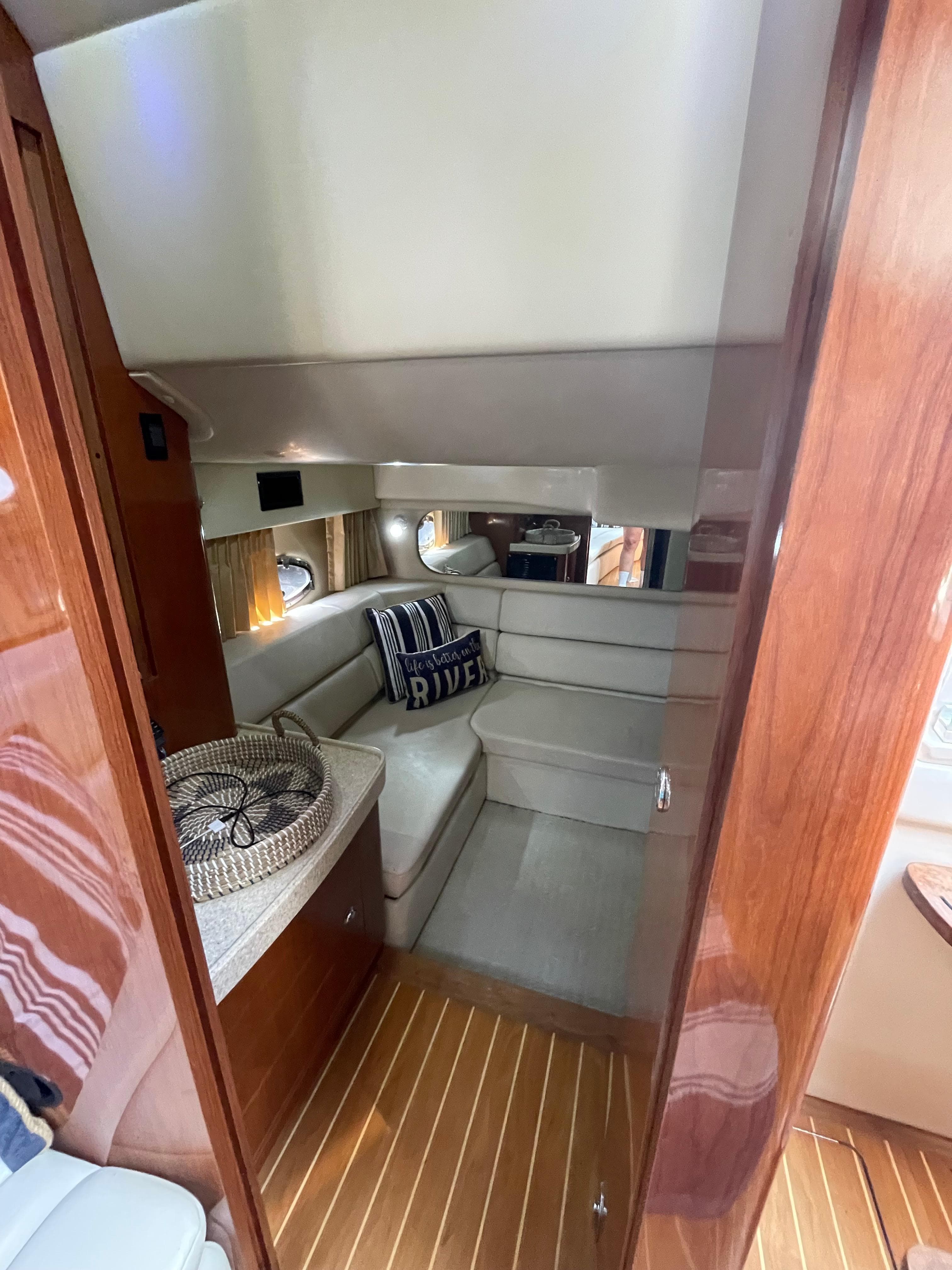 Interior of 2005 Regal Commodore 3560 IB yacht with cozy seating area.