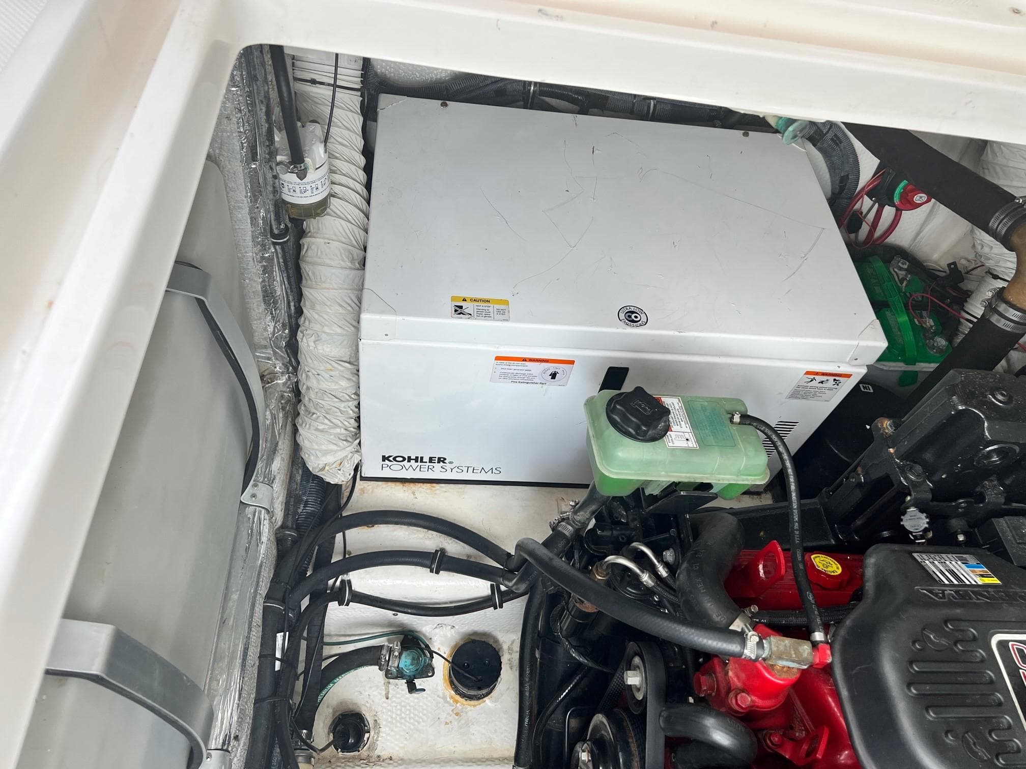 2008 Rinker 350 Express Cruiser engine compartment with Kohler power system.