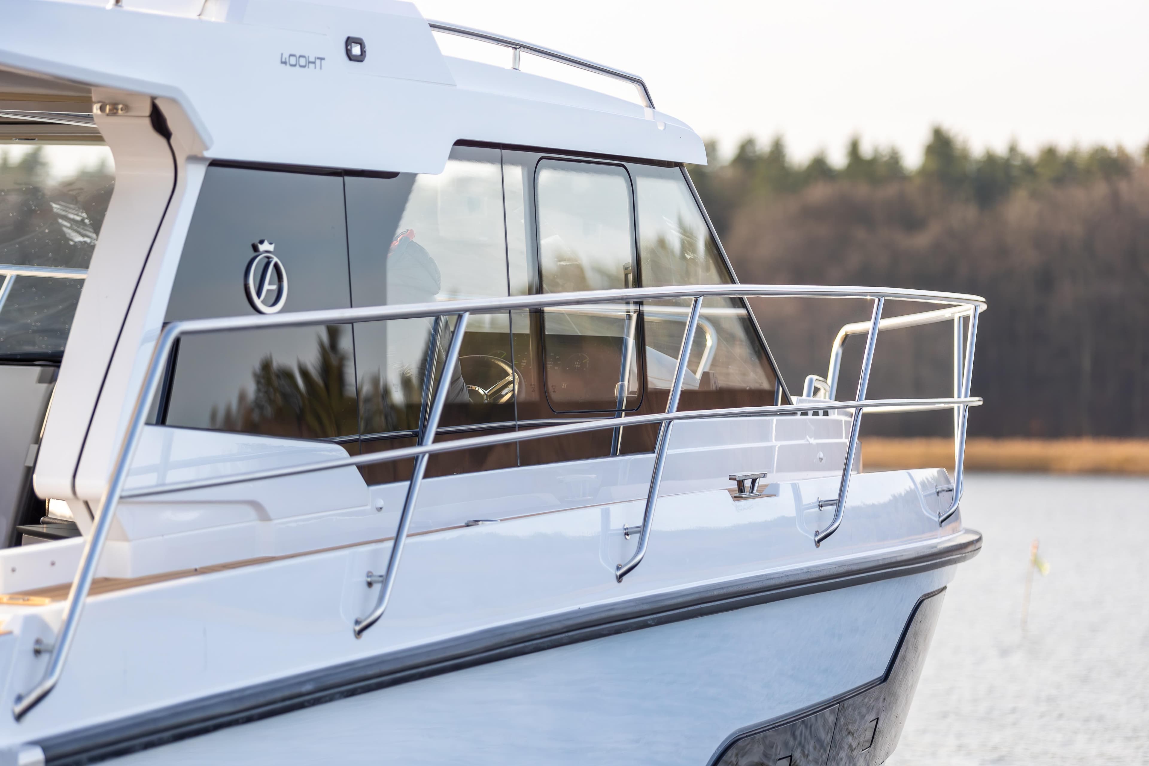 2026 Aquador 400HT boat on water, showcasing sleek design and modern features.