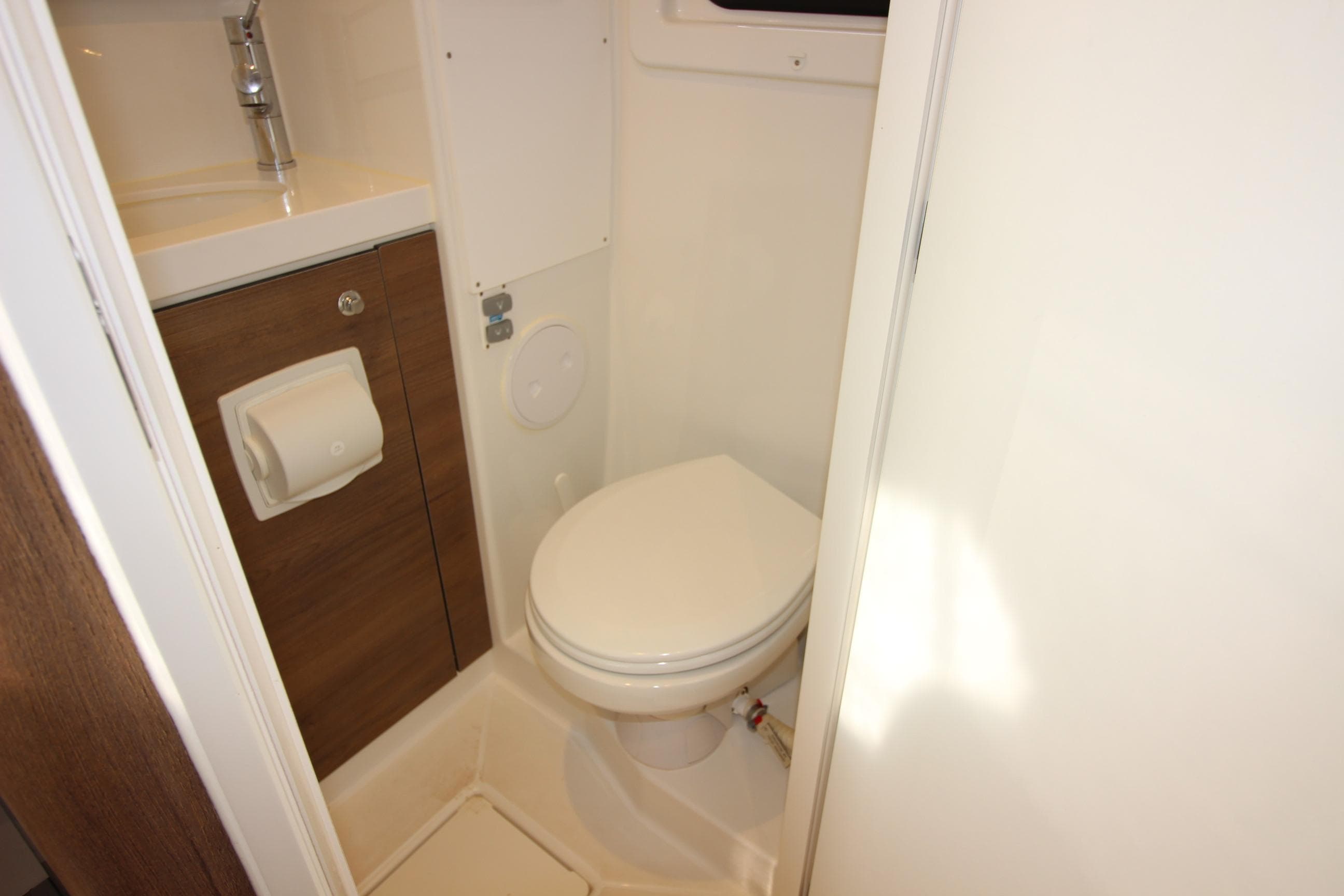 Compact bathroom in 2022 Bali 4.6 model with toilet and sink.