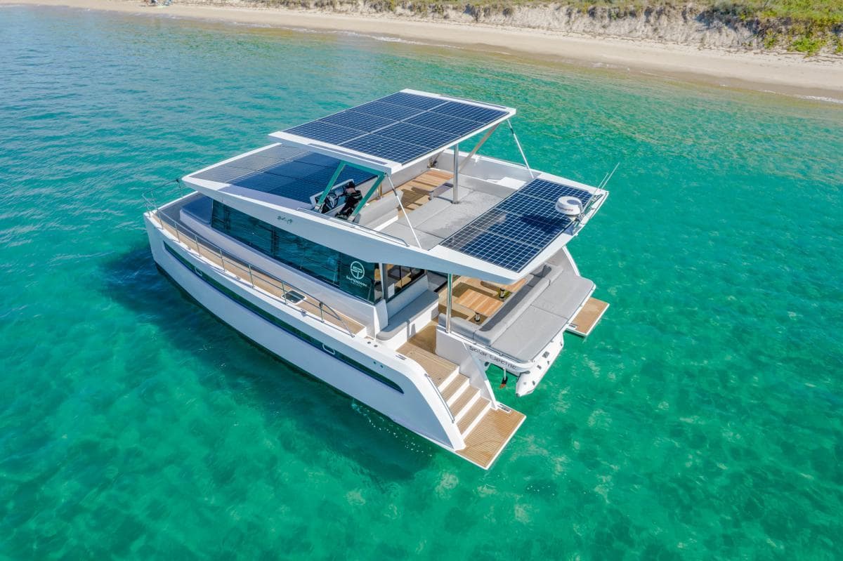 Solar-powered Sunpower E 44 VIP yacht cruising in clear turquoise waters, 2026 model.