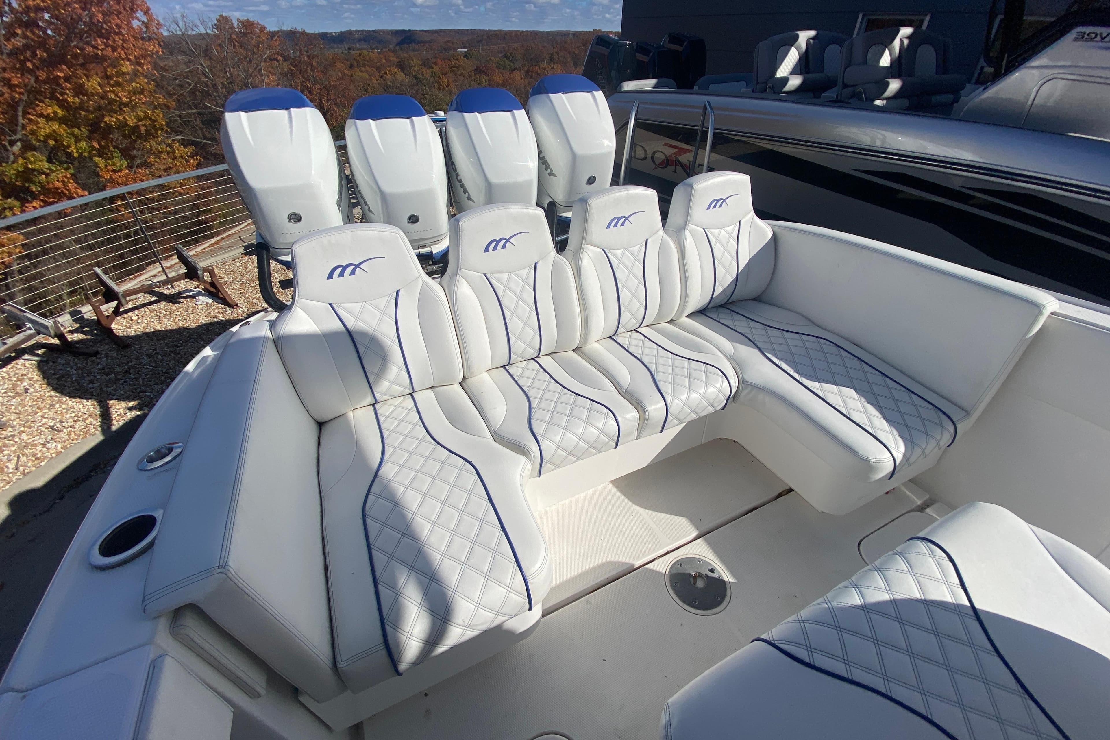 2017 Midnight Express 39S Cuddy boat with luxurious white seating and multiple engines.