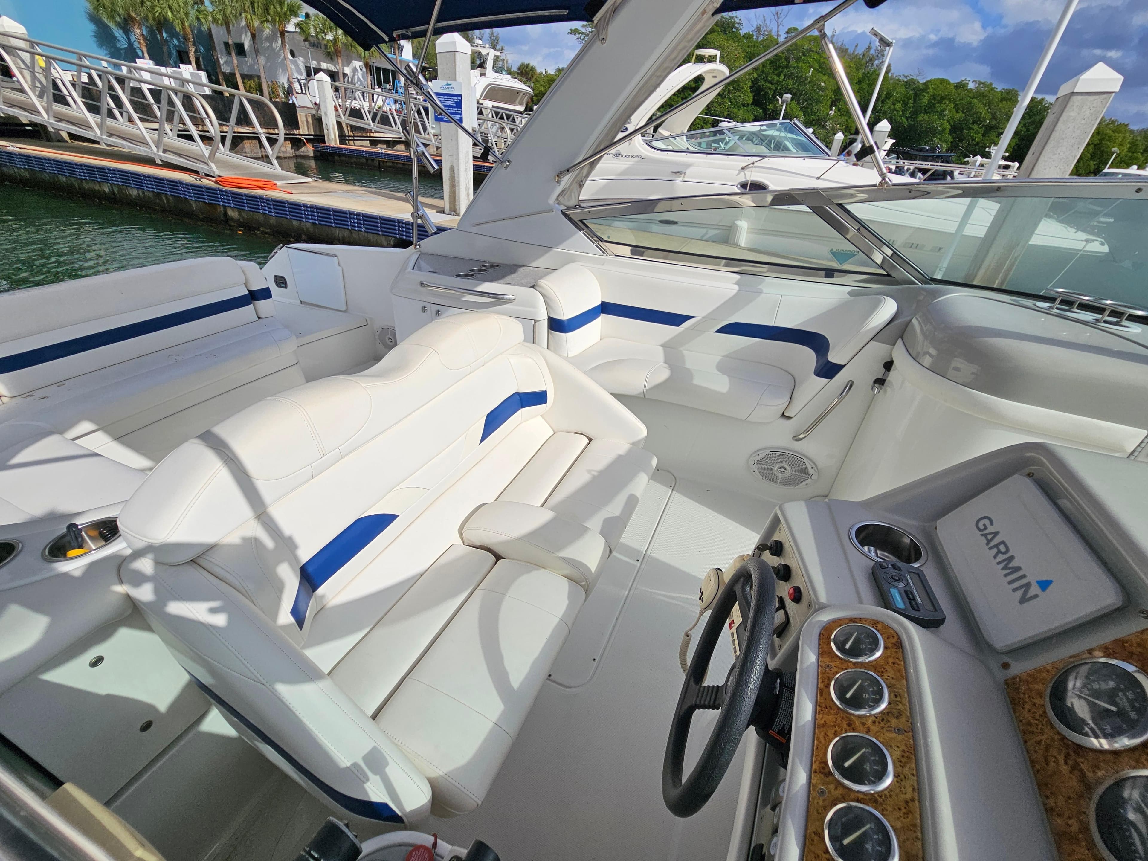 2007 Formula 280 Bowrider boat interior with white seating and Garmin navigation system.