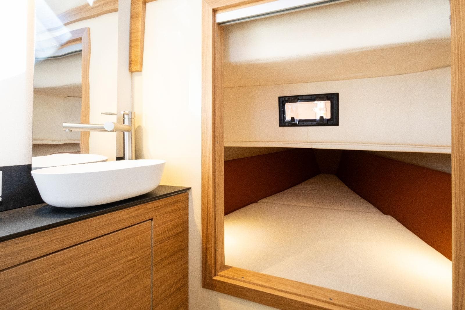 Interior of 2025 AlCustom LIPARI 31 yacht, featuring a modern bathroom and cozy cabin.