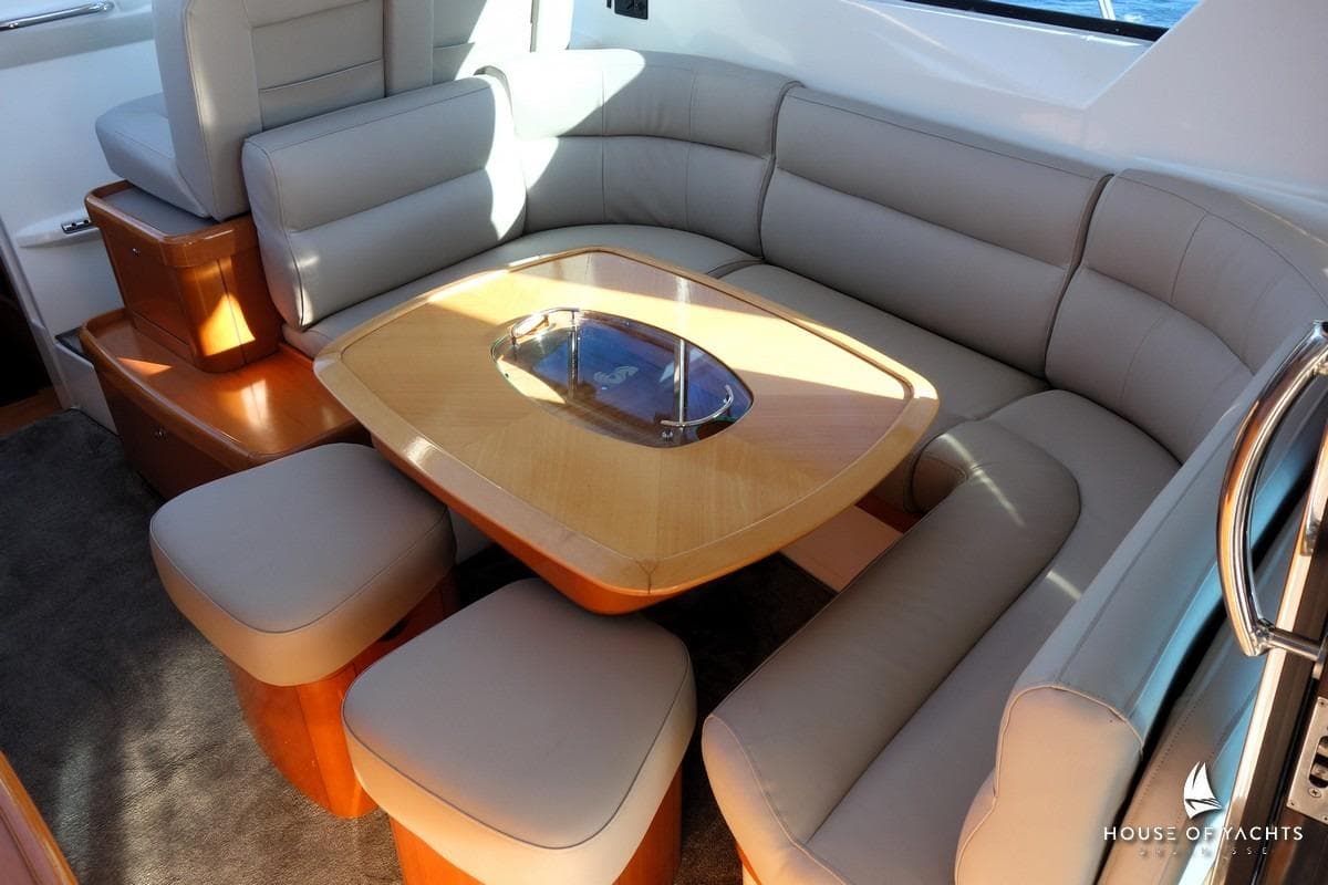 Luxurious interior of 2005 Beneteau Flyer 12 yacht with plush seating and elegant table.