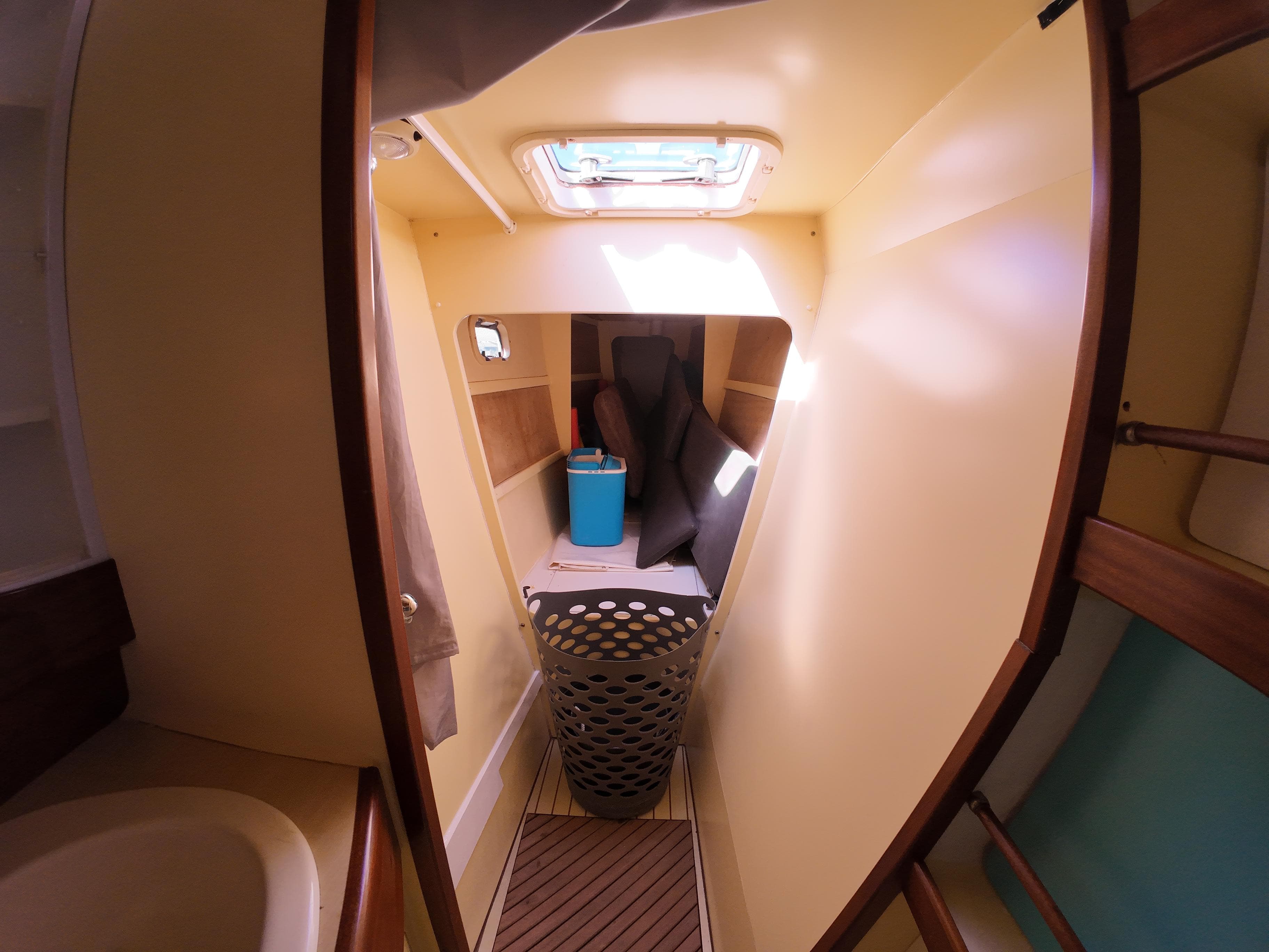 Interior of 2006 Custom Piana 40 boat, featuring cozy cabin space and natural lighting.