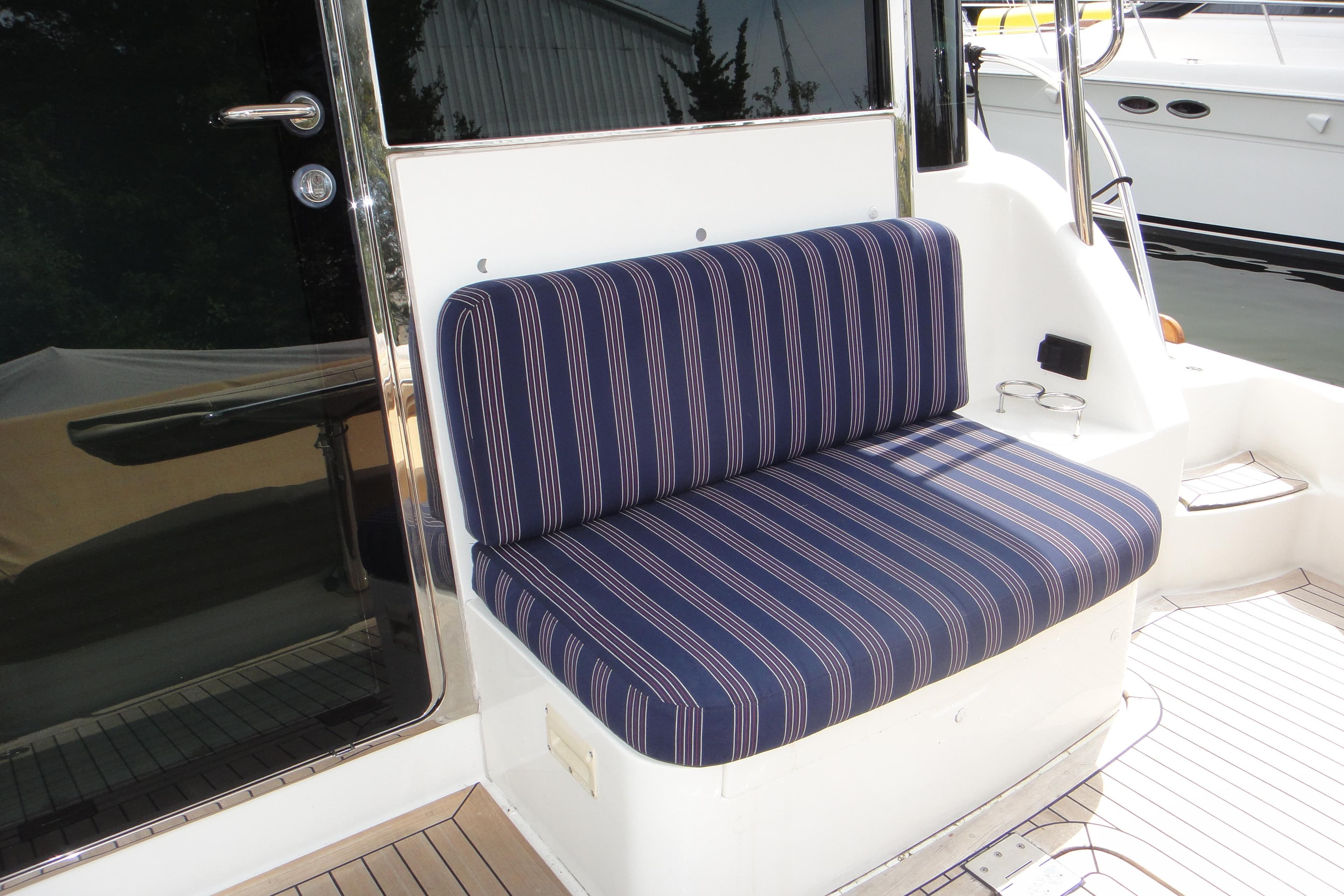Striped seating on 2018 Sabre 48 SE yacht deck, featuring sleek design and comfort.