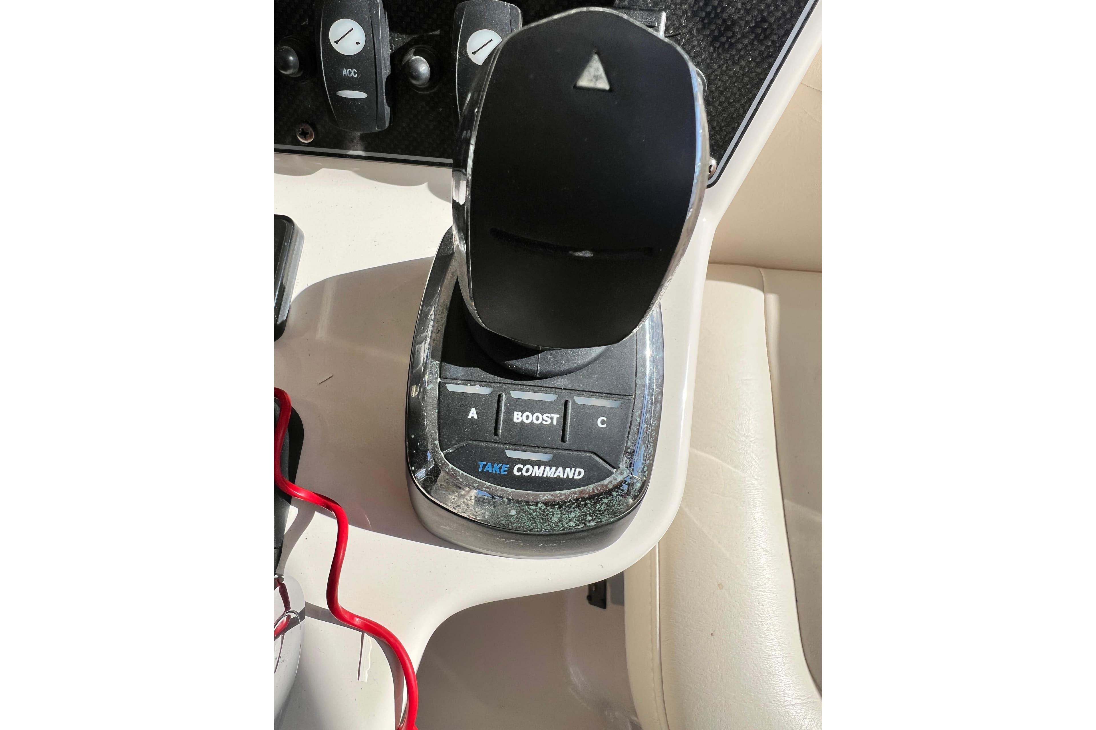 Control panel of a 2017 Grady-White Express 330 boat with joystick and buttons.