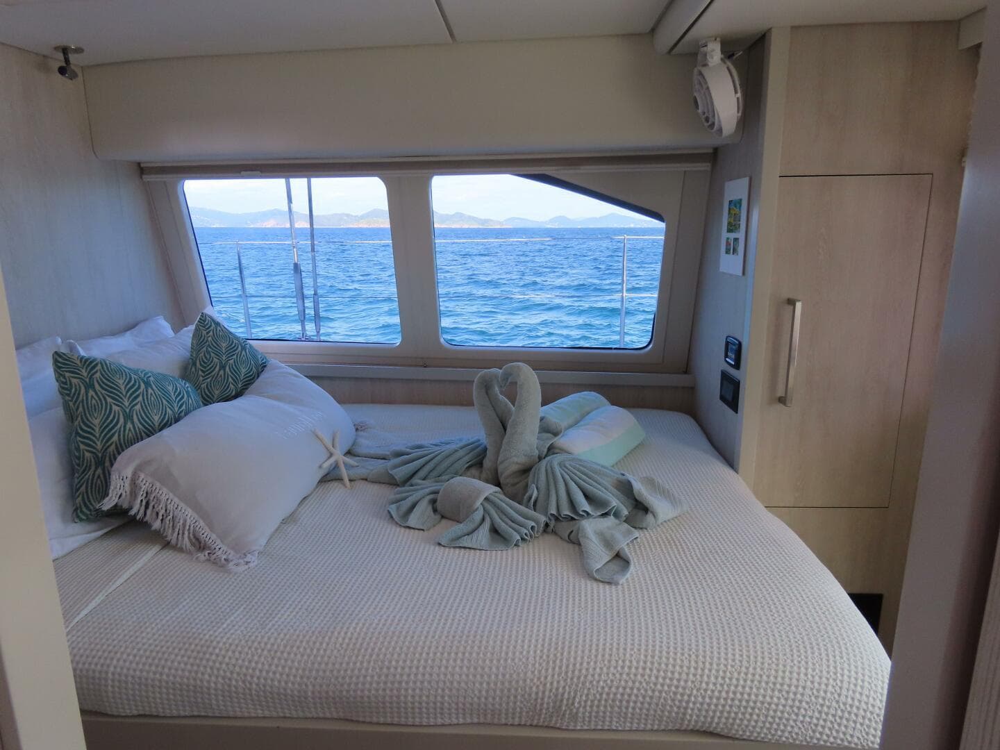 Luxurious cabin interior of 2016 Leopard 58 yacht with ocean view.
