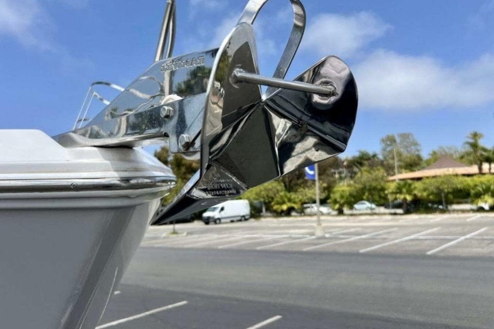 Close-up of a 2019 Regal 26 XO boat anchor in a parking lot.