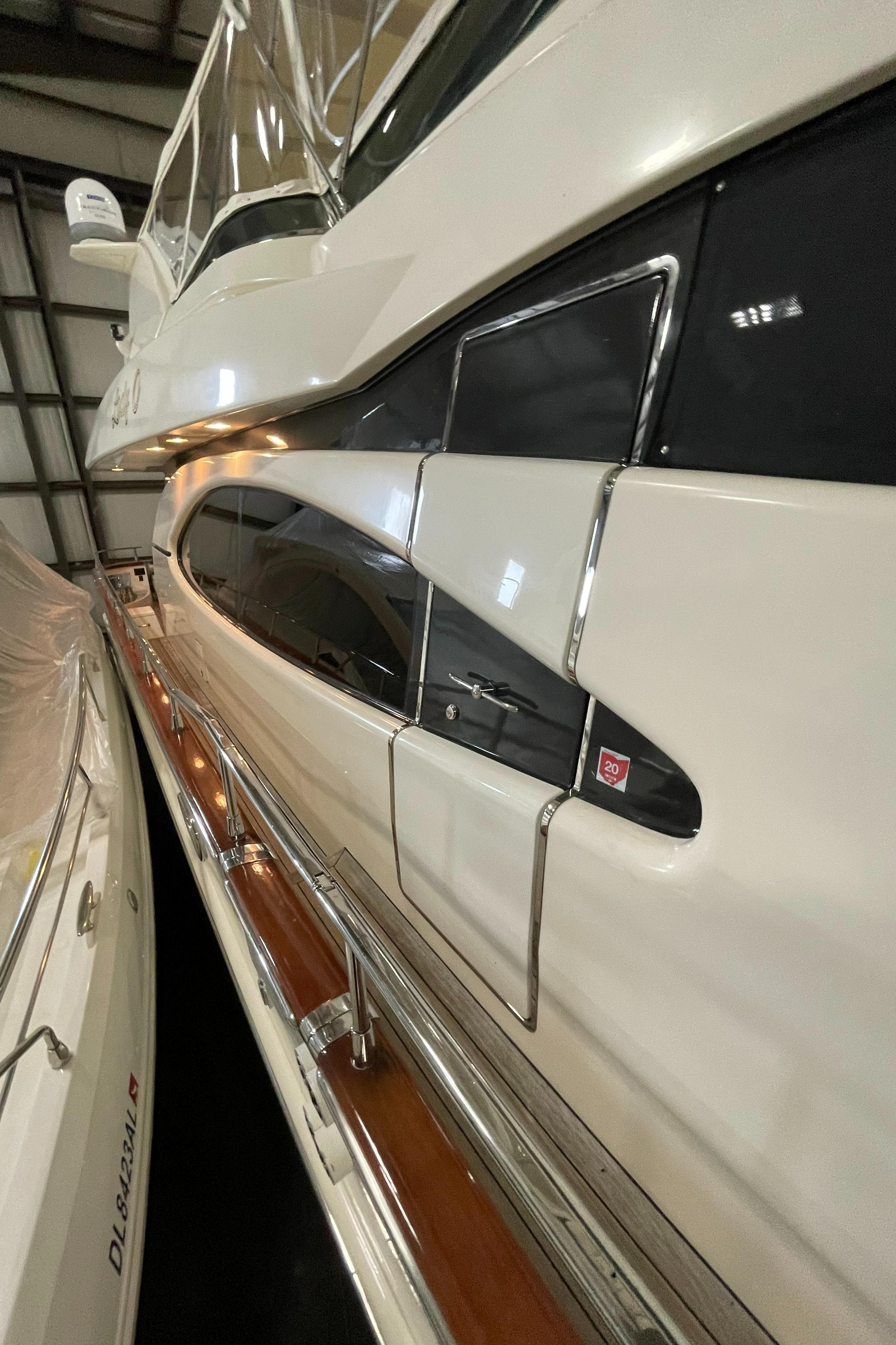 2004 Azimut 74 yacht side view in a marina.