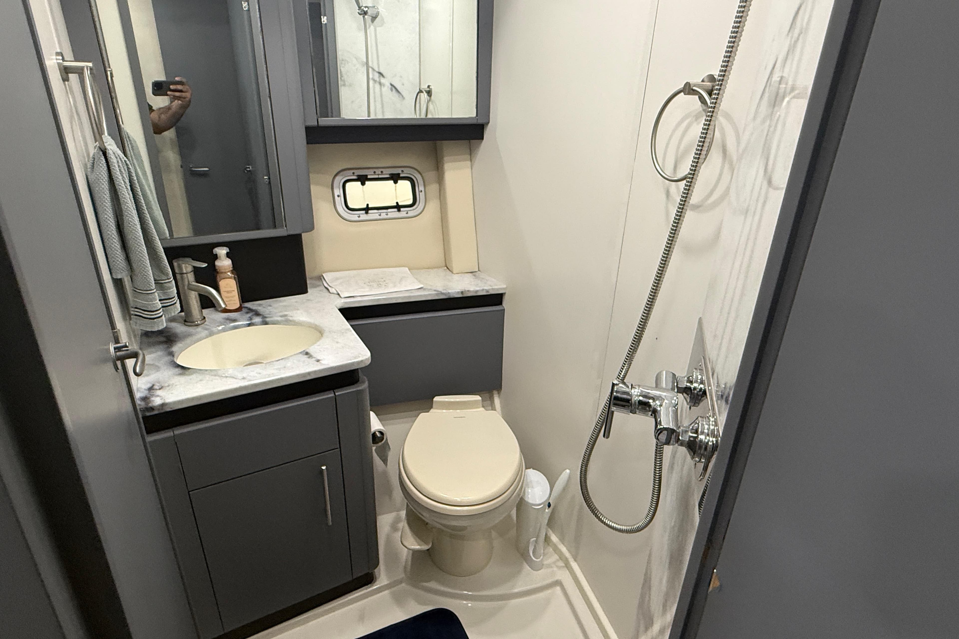 2009 Carver 44 Sojourn yacht bathroom with shower, sink, and toilet.