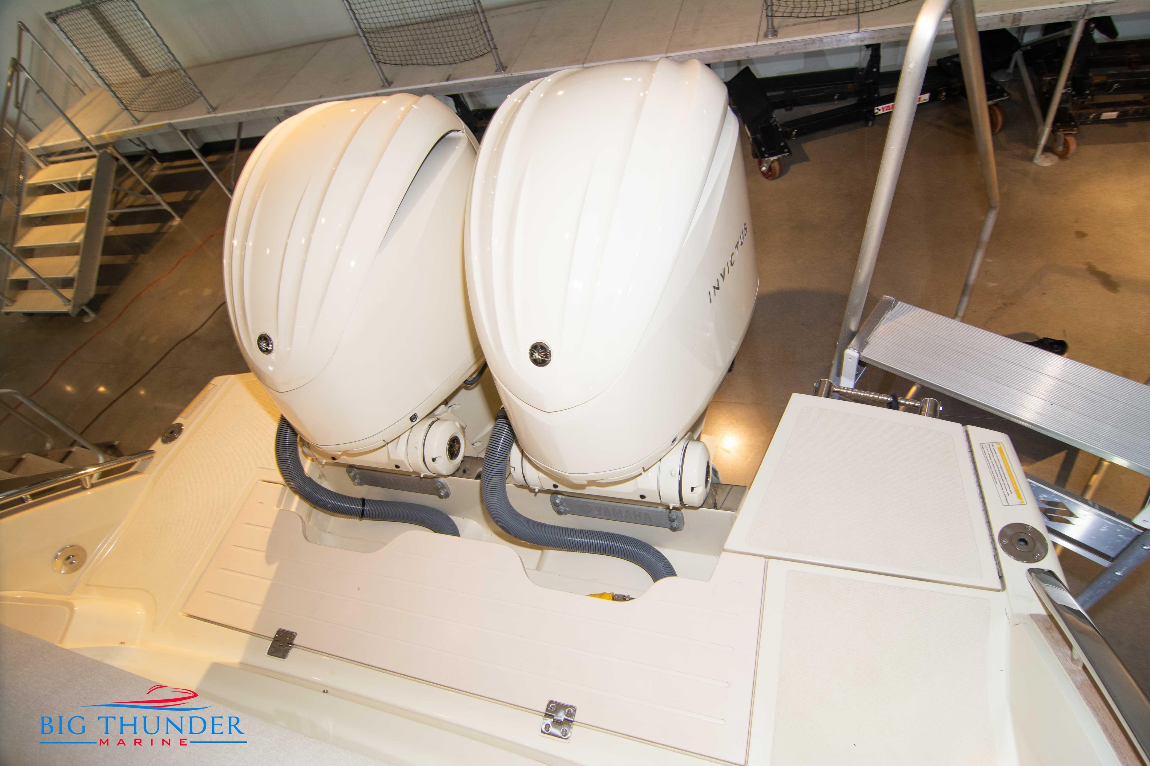 2024 Invictus GT320S boat with dual outboard engines at Big Thunder Marine.