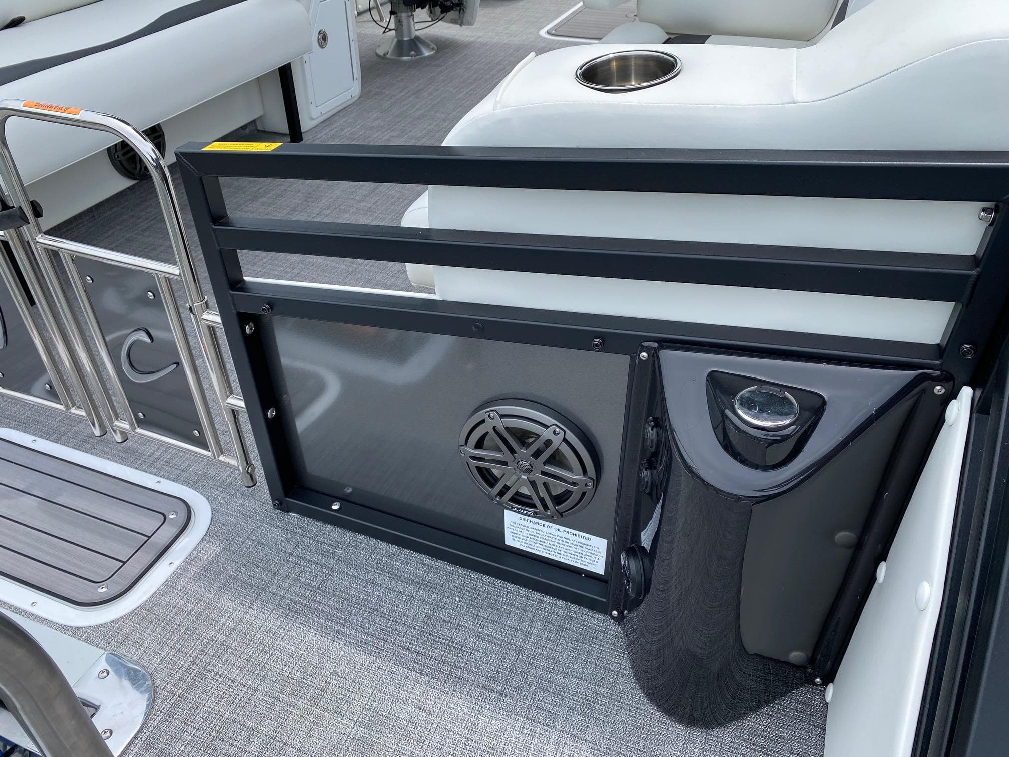 2024 JC Neptoon Sport 23TT DSL boat interior with seating and speaker.