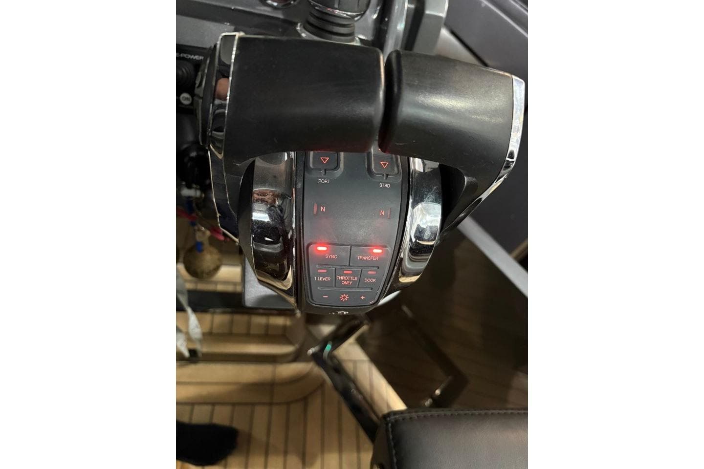Throttle controls of a 2021 Novamarine Black Shiver 100 boat, featuring modern design elements.