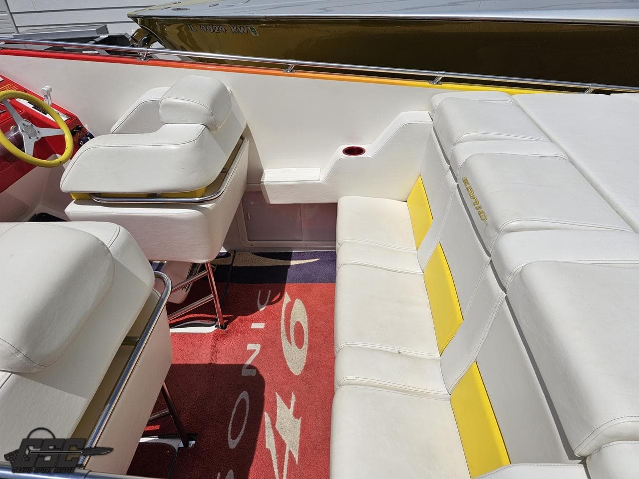 2004 Sonic USA 45SS boat interior with white and yellow seating, red accents.