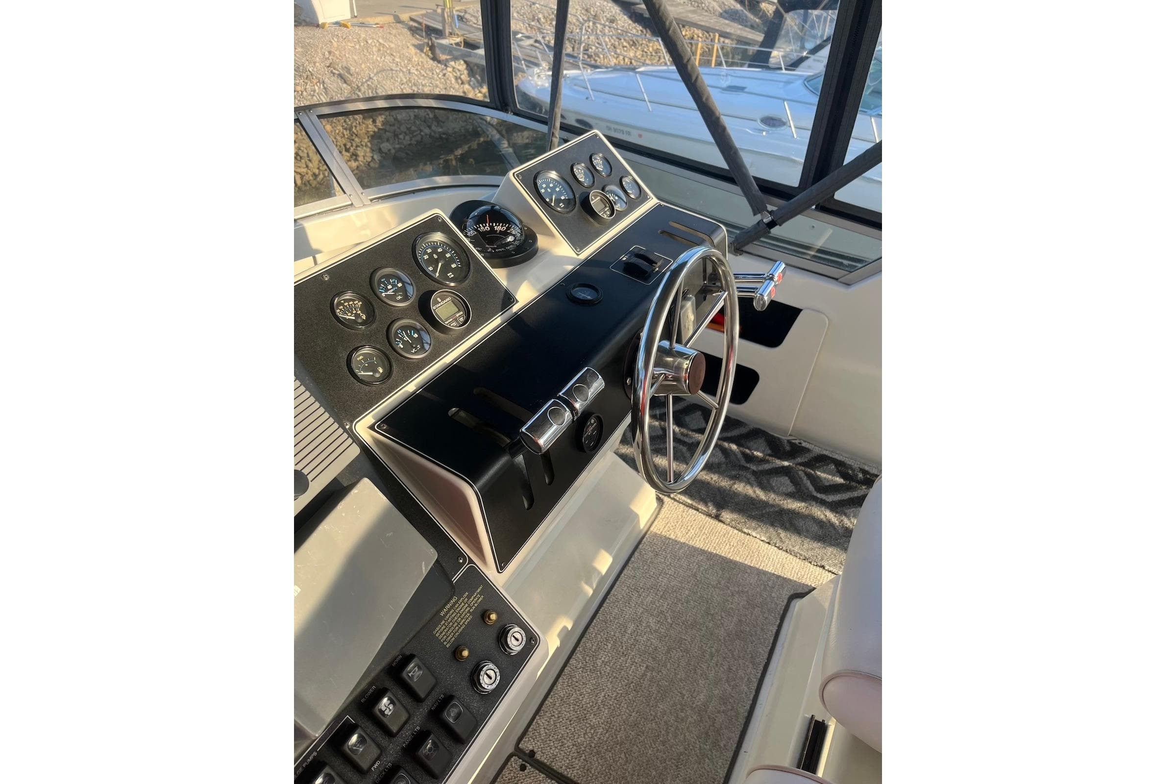 1993 Carver 350 Aft Cabin Motor Yacht helm with gauges and steering wheel.
