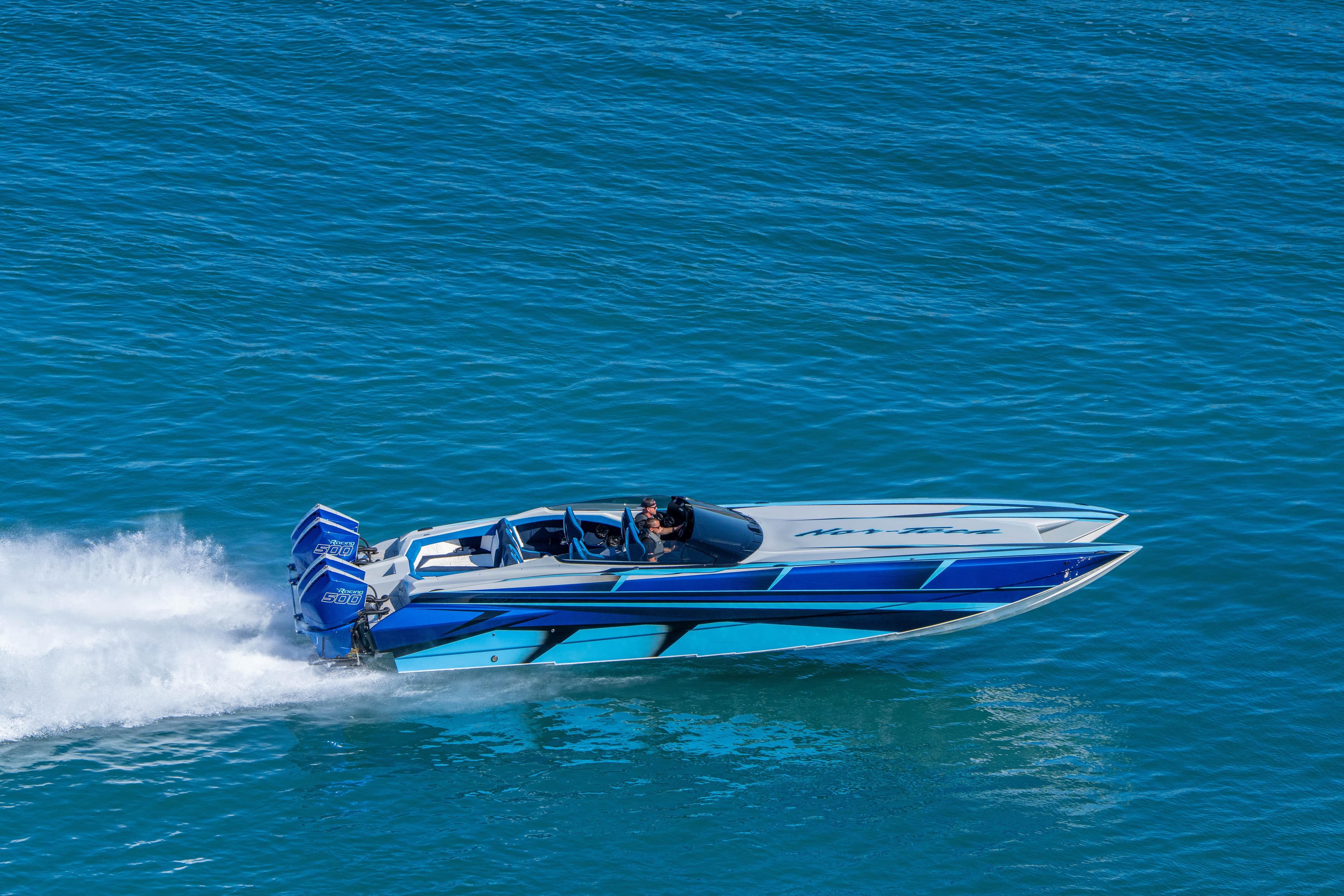 2026 Nor-Tech 4000 Super Catamaran speeding on blue ocean waters.