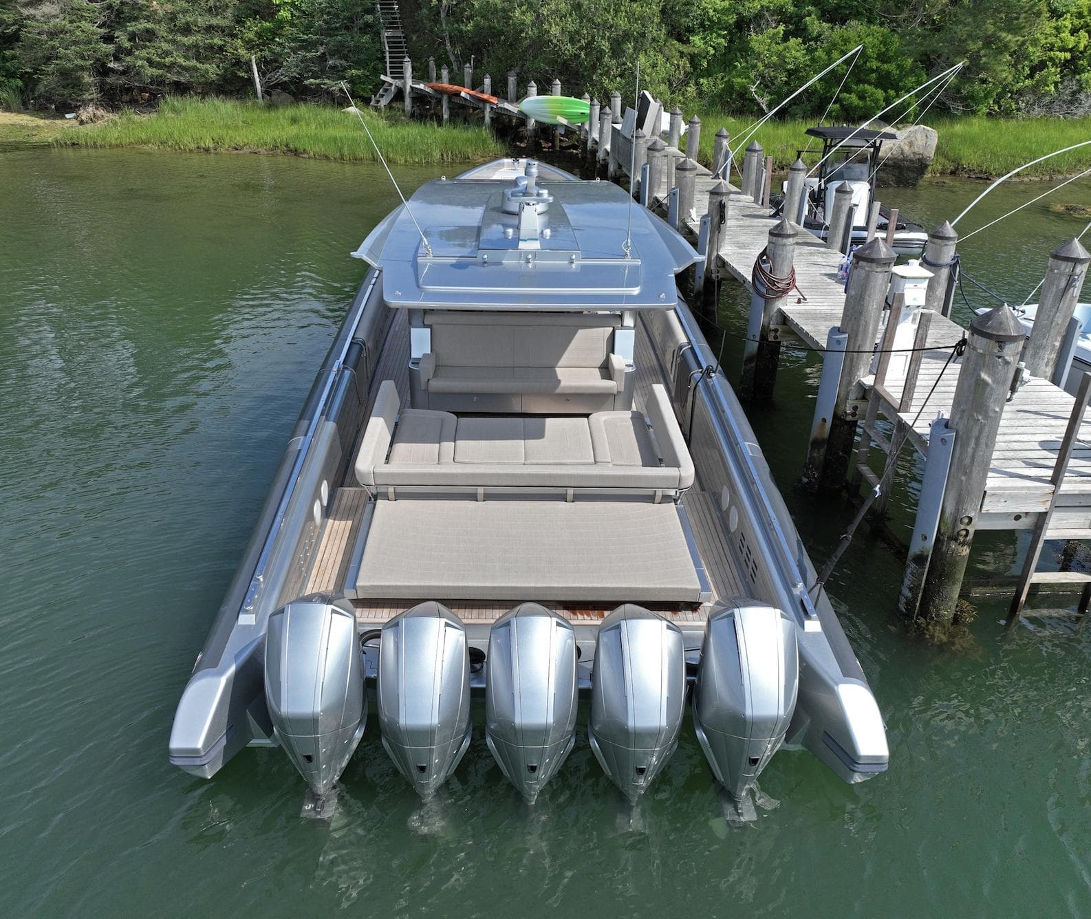 Novamarine Black Shiver 160, 2023 model, docked with four powerful engines, sleek design.