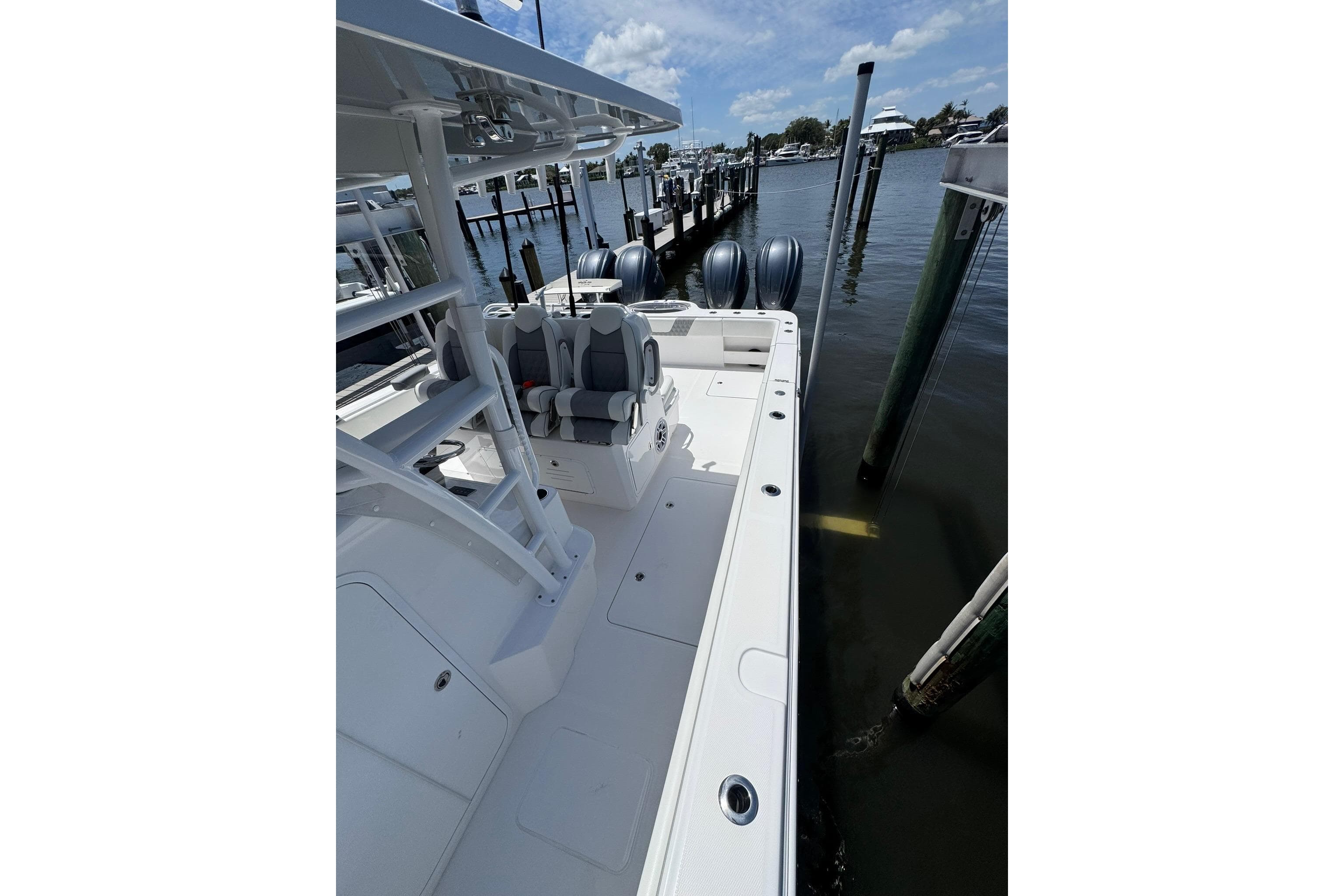 2024 Invincible 35 Catamaran docked, showcasing sleek design and dual engines.