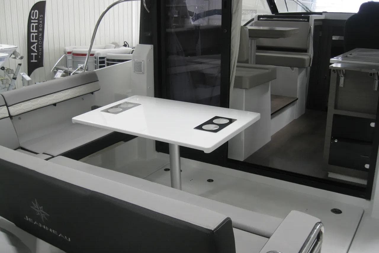 2026 Jeanneau NC 895 Series 2 boat interior with seating and table setup.