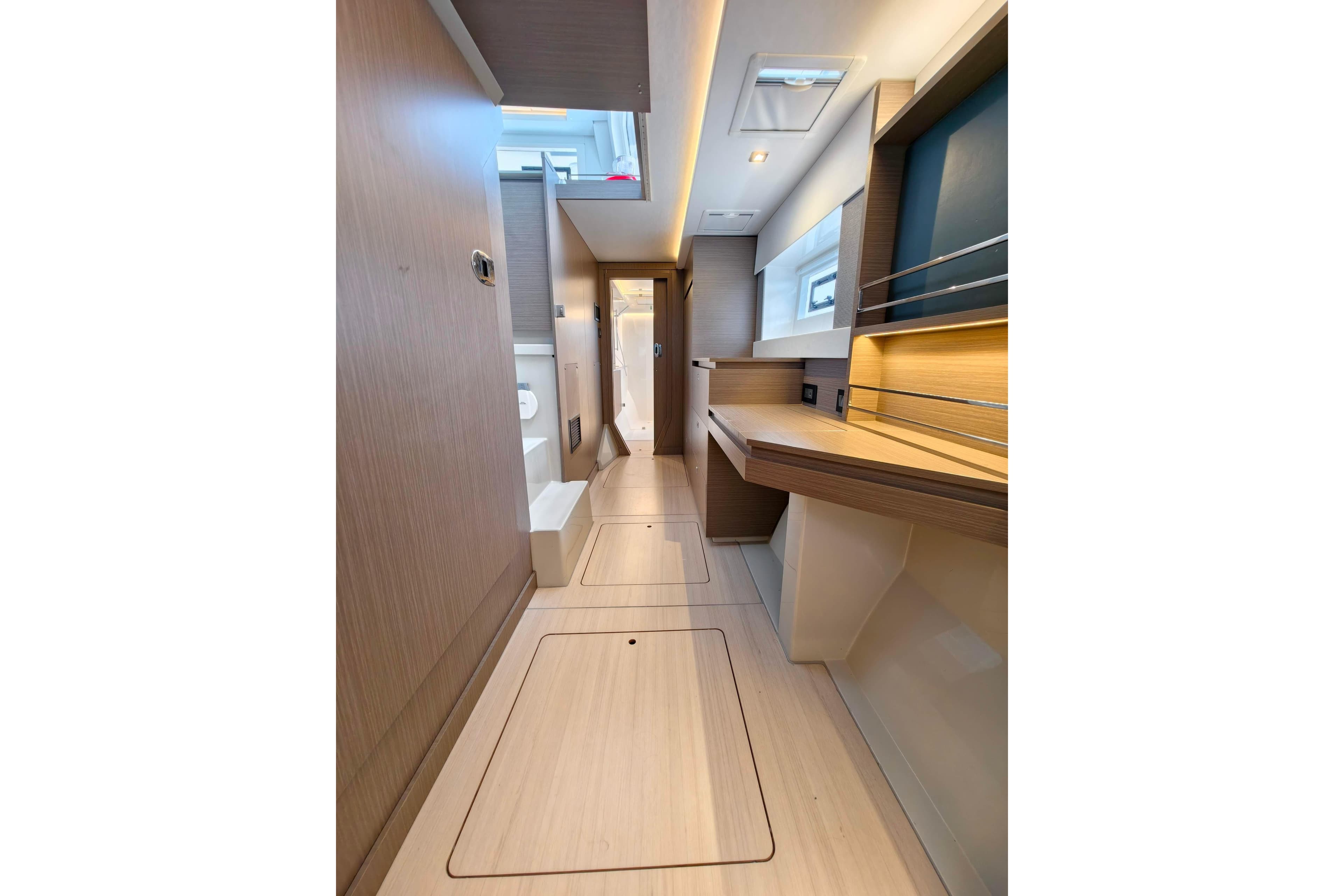 Modern interior of 2025 Leopard 42 yacht, featuring sleek wood finishes and ample natural light.