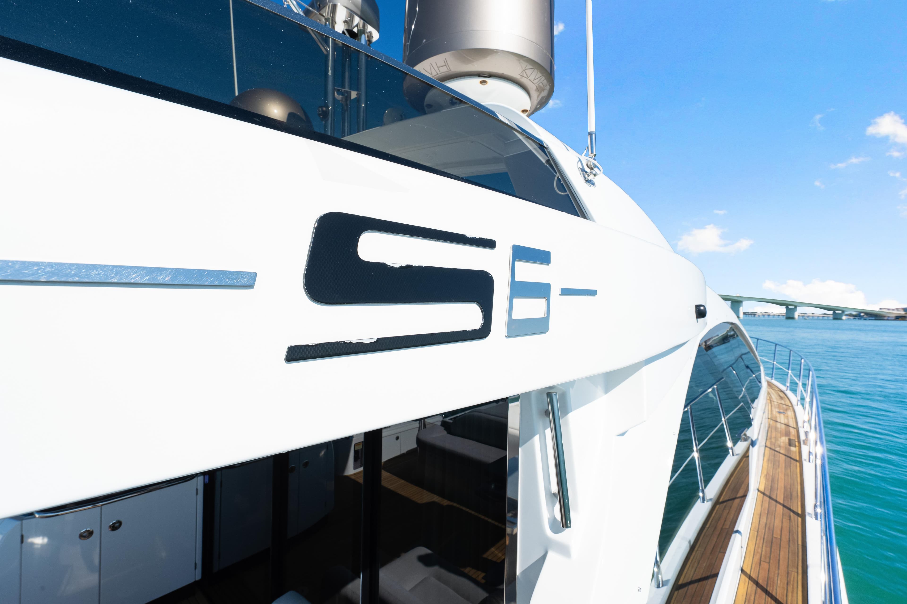 2020 Azimut S6 yacht on clear blue water, showcasing sleek design and luxury features.