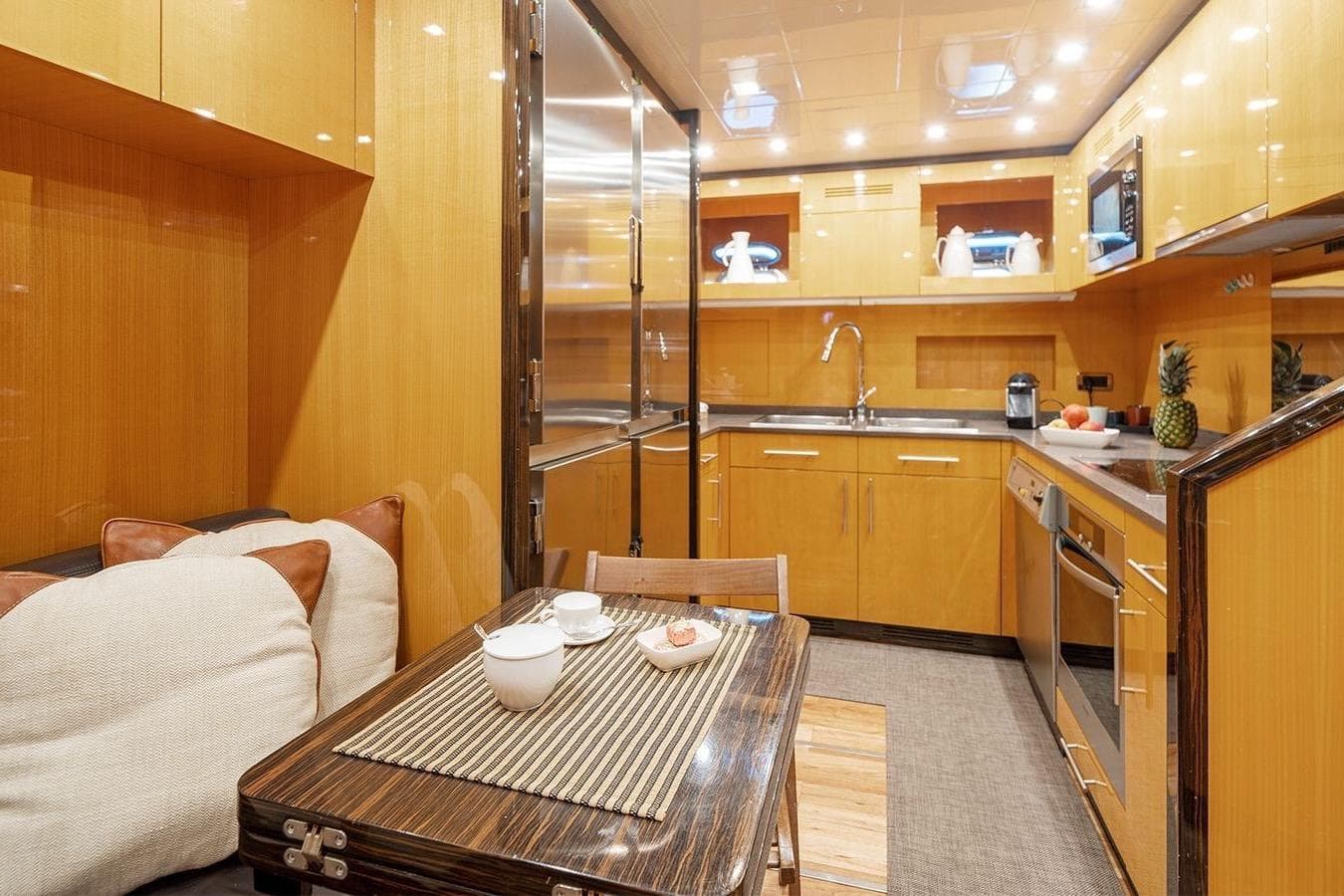 Luxurious kitchen interior of 2008 Overmarine Mangusta 92 yacht with modern amenities.