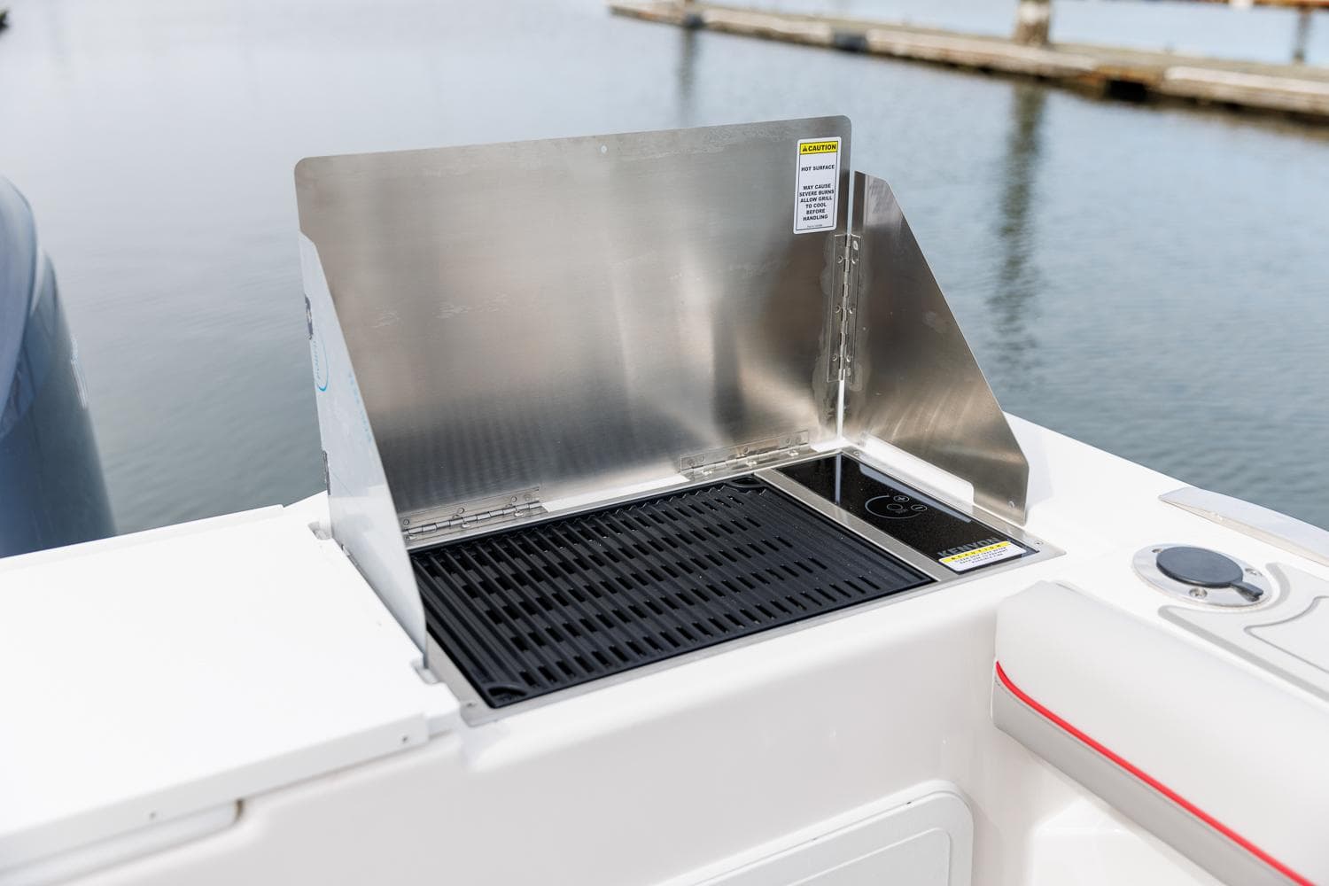 Outdoor grill on Solara S-310 CW boat, 2025 model, by the water.