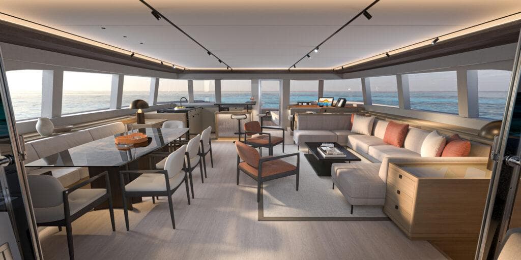 Luxurious interior of 2025 Lagoon 83 yacht with modern furnishings and panoramic ocean views.