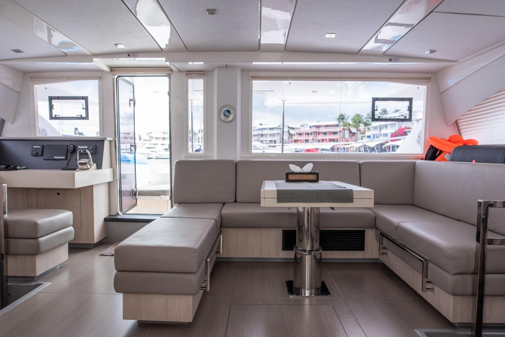 Luxurious interior of 2019 Leopard 51 Powercat yacht with modern seating and large windows.