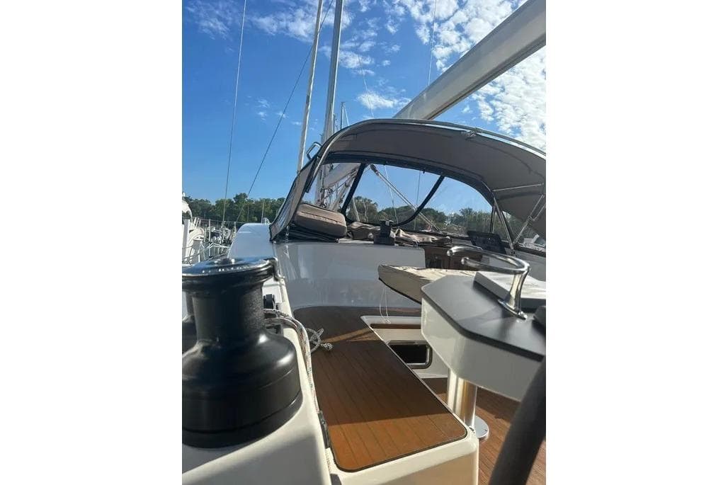 2016 Bavaria Vision 46 yacht deck with canopy under blue sky.