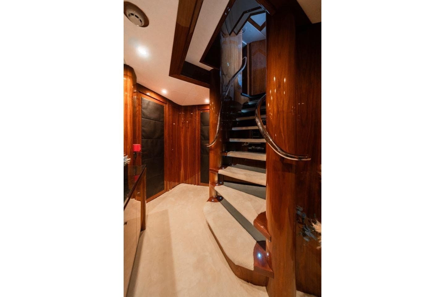 Luxurious interior of 2009 Sunseeker 34 Metre Yacht with elegant wooden staircase.