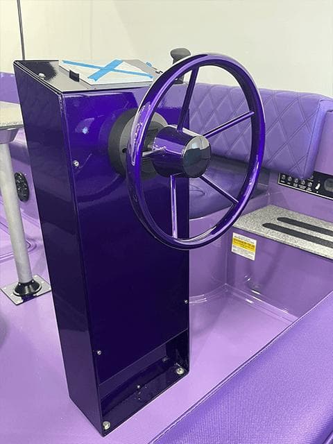 Purple steering console of 2023 Vision Marine Technologies Fantail 217 boat.