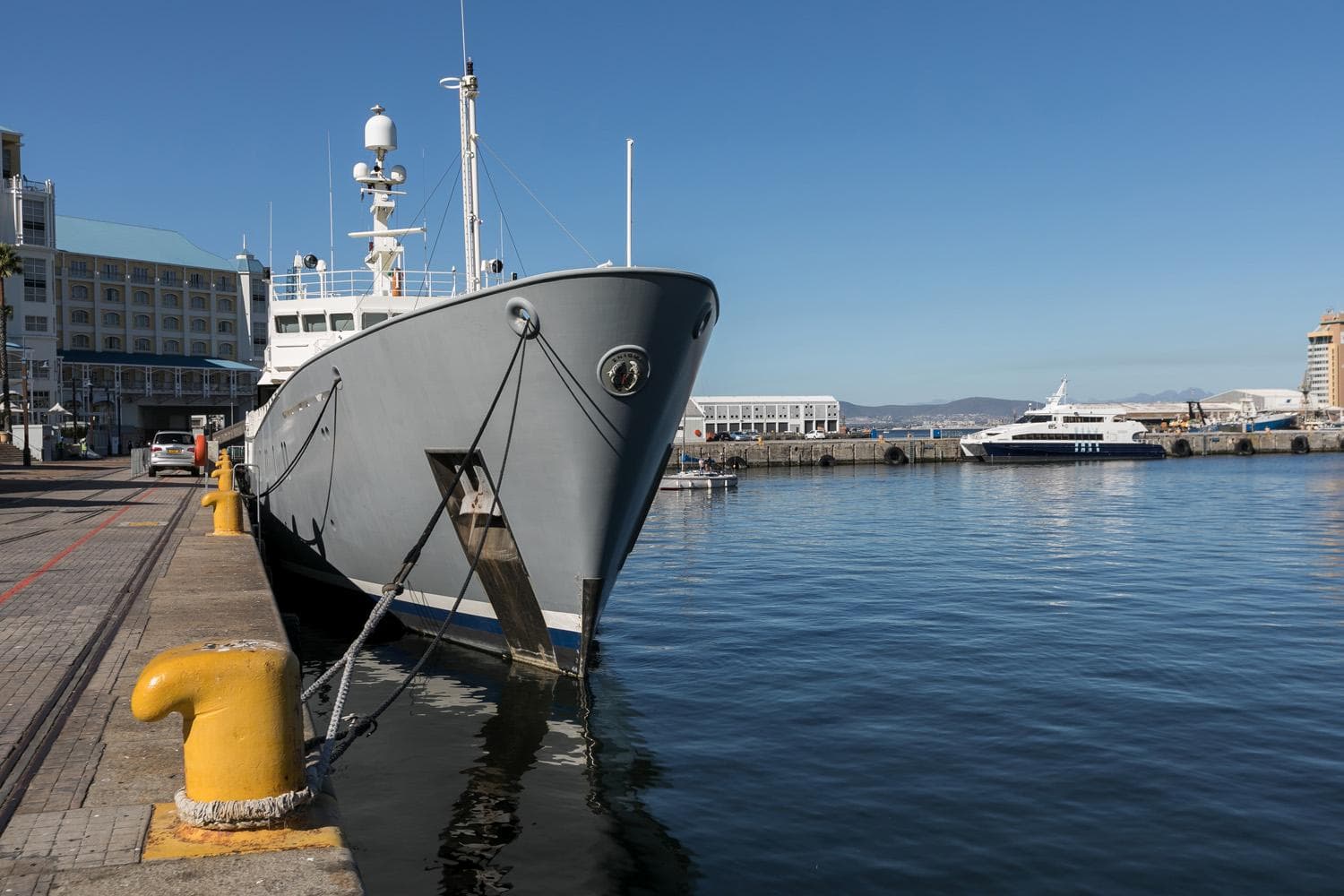 1987 Richards Shipbuilders Expedition vessel docked at a sunny harbor.